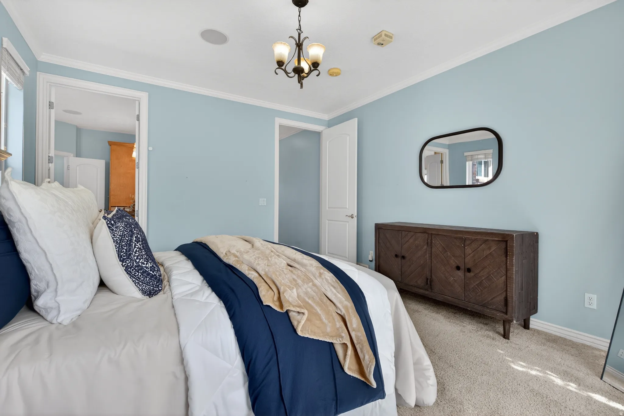 Light blue wall paint and white trim create a bright aesthetic