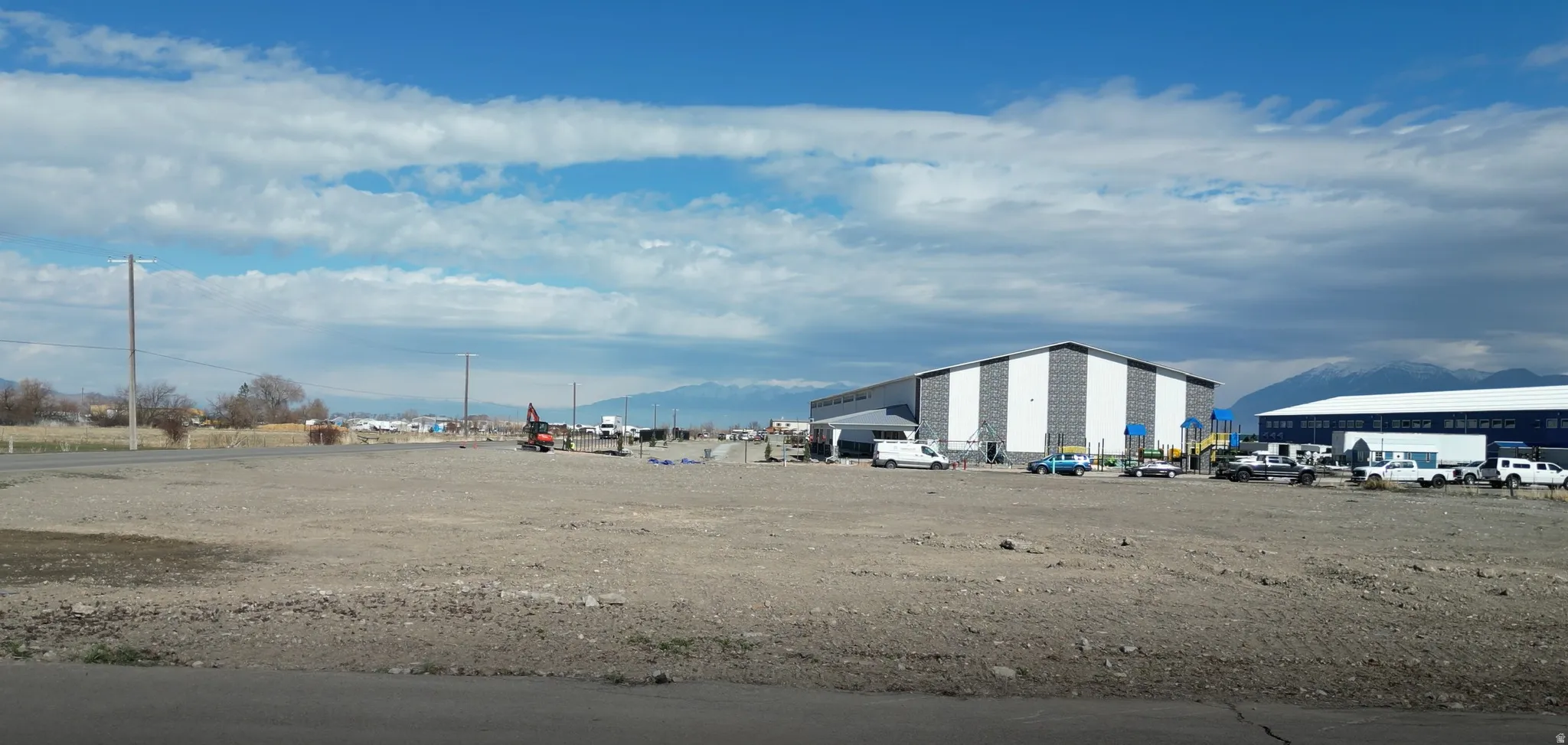 Expansive undeveloped land featuring a gravel surface