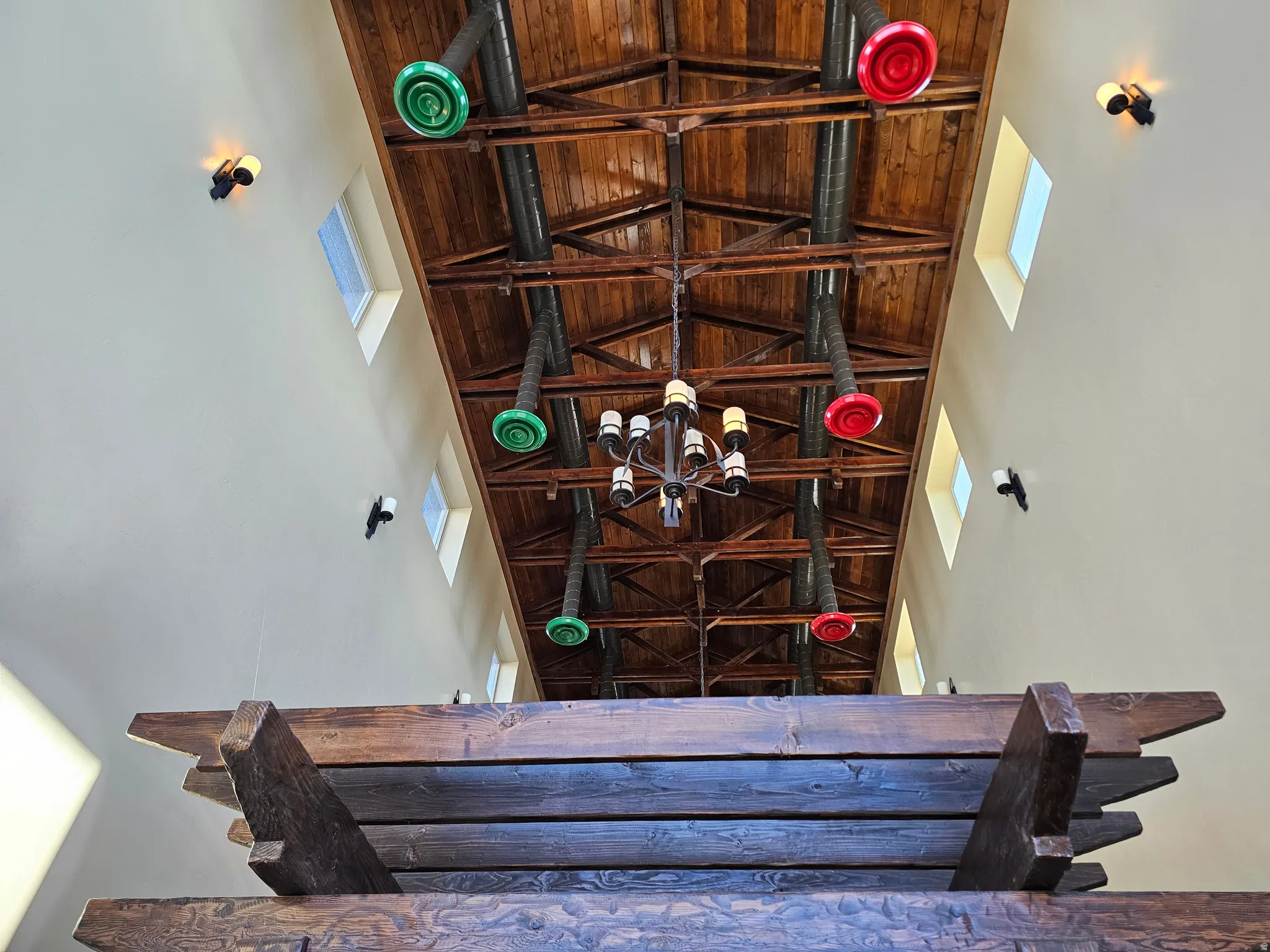 Vaulted wood-plank ceiling with exposed timber beams