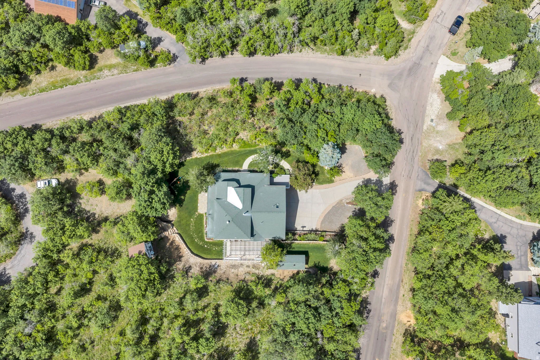 mature trees, and a curved driveway