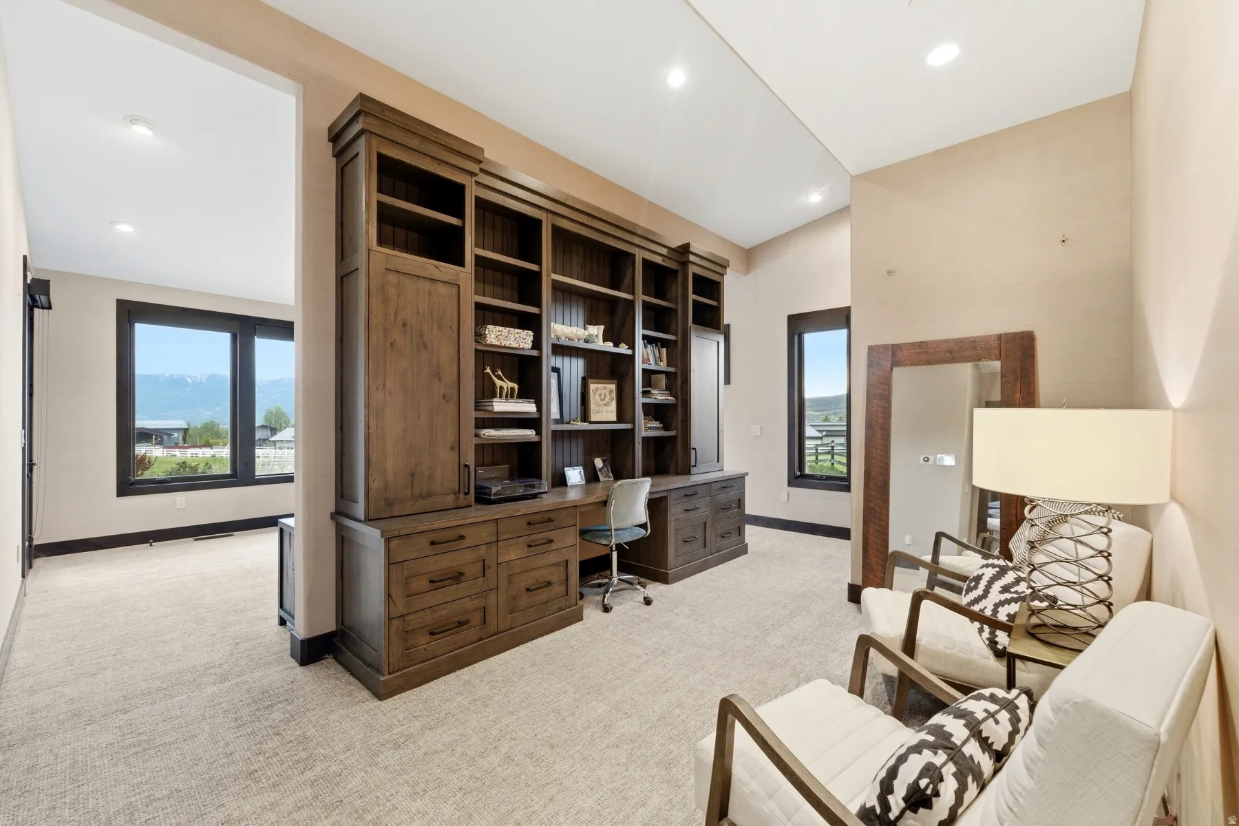 Custom built-in wood-finish shelving unit with integrated desk space