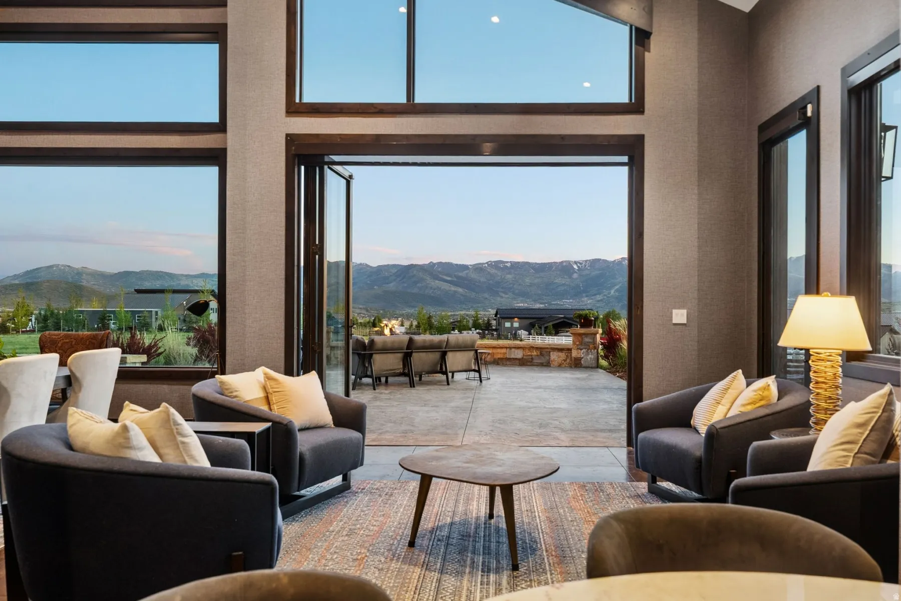 Spacious interior featuring large picture windows and a folding glass door system