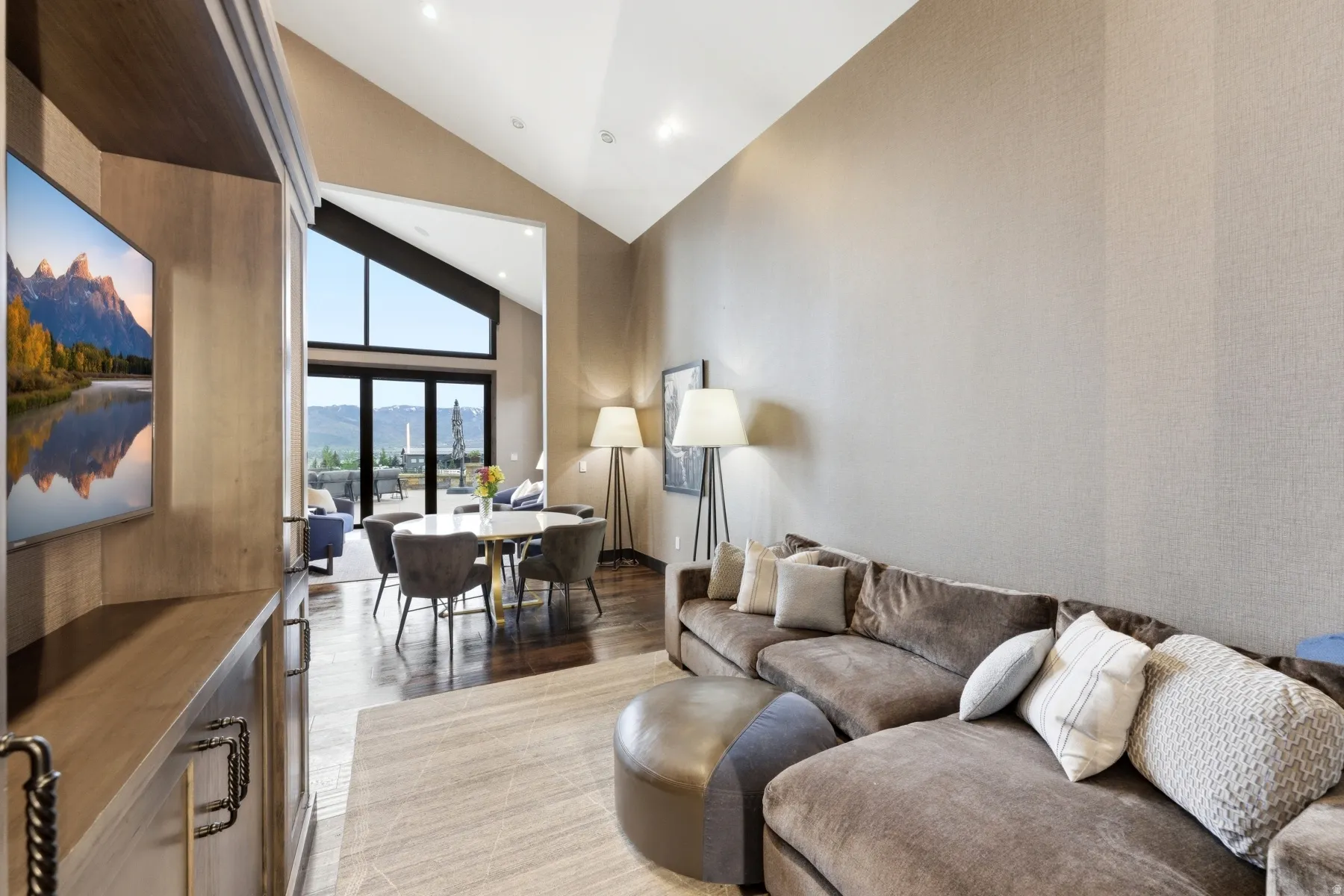 Vaulted ceilings with recessed lighting define this interior space