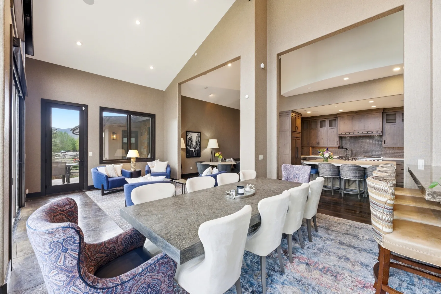 Spacious dining area with vaulted ceilings and recessed lighting