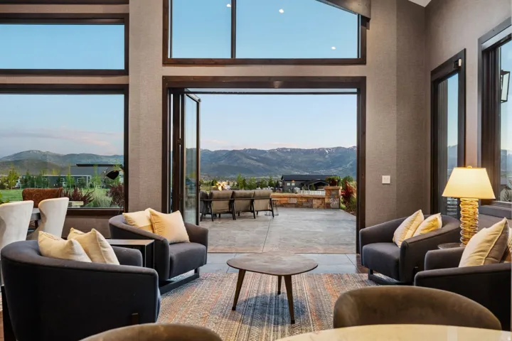 Spacious interior featuring large picture windows and a folding glass door system