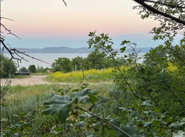 Expansive natural landscape with water and mountain scenery