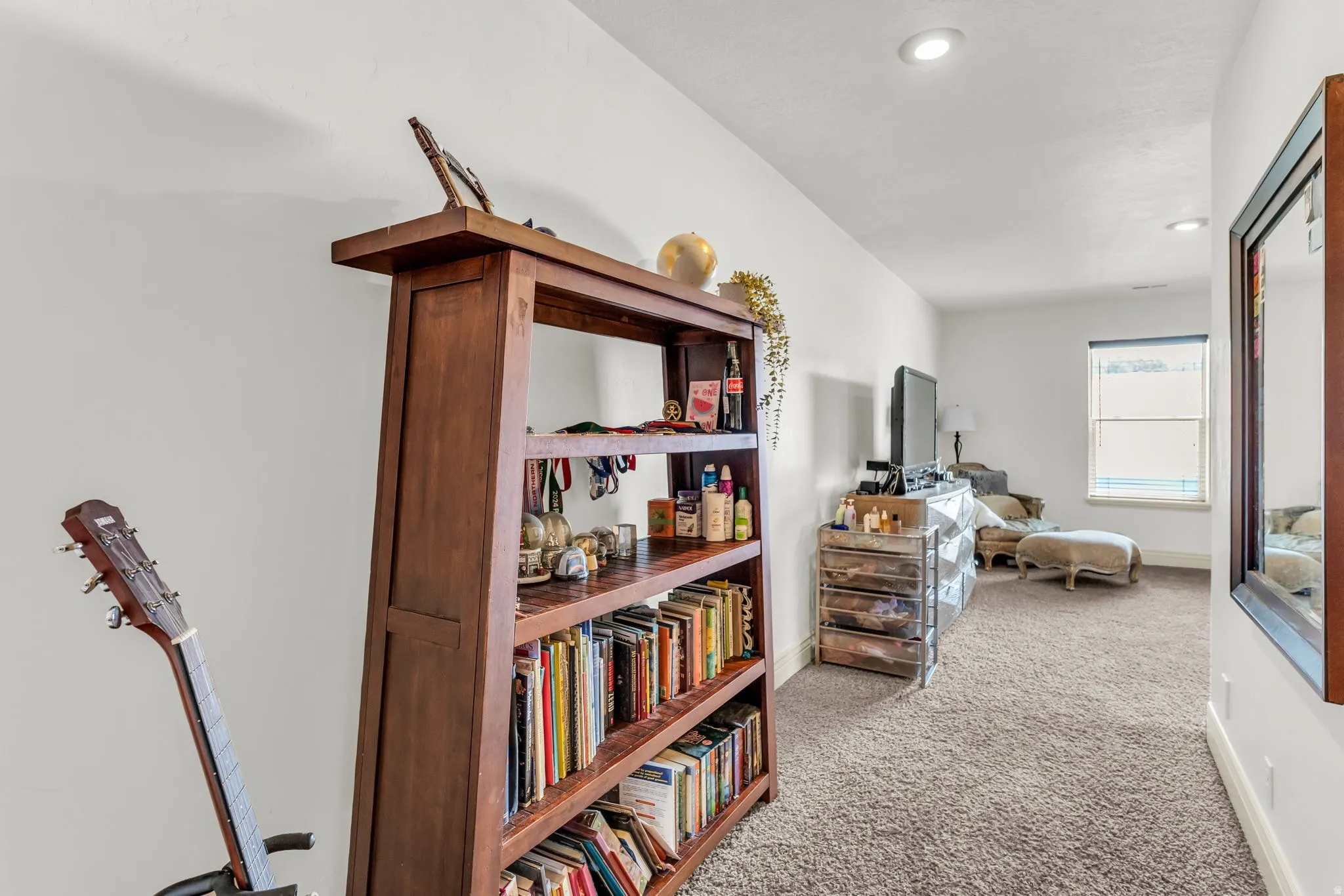 Attic space spacious 3rd  bedroom  featuring sloped ceilings, recessed lighting, a window with blinds, and neutral carpeting