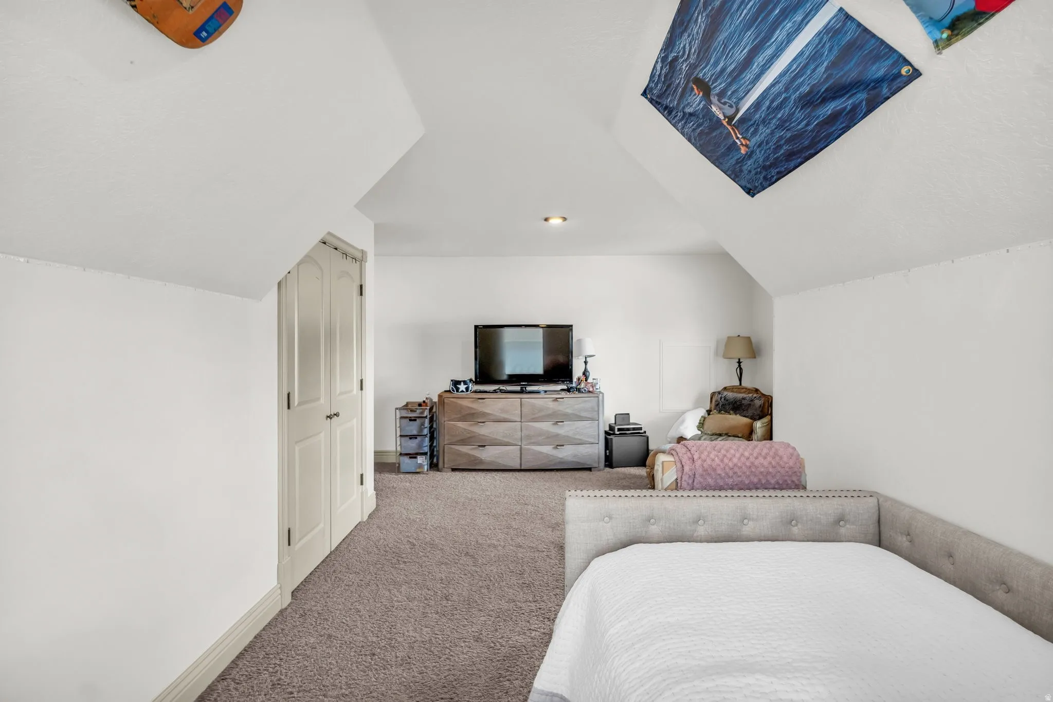 Attic space spacious 3rd  bedroom  featuring sloped ceilings, recessed lighting, a window with blinds, and neutral carpeting