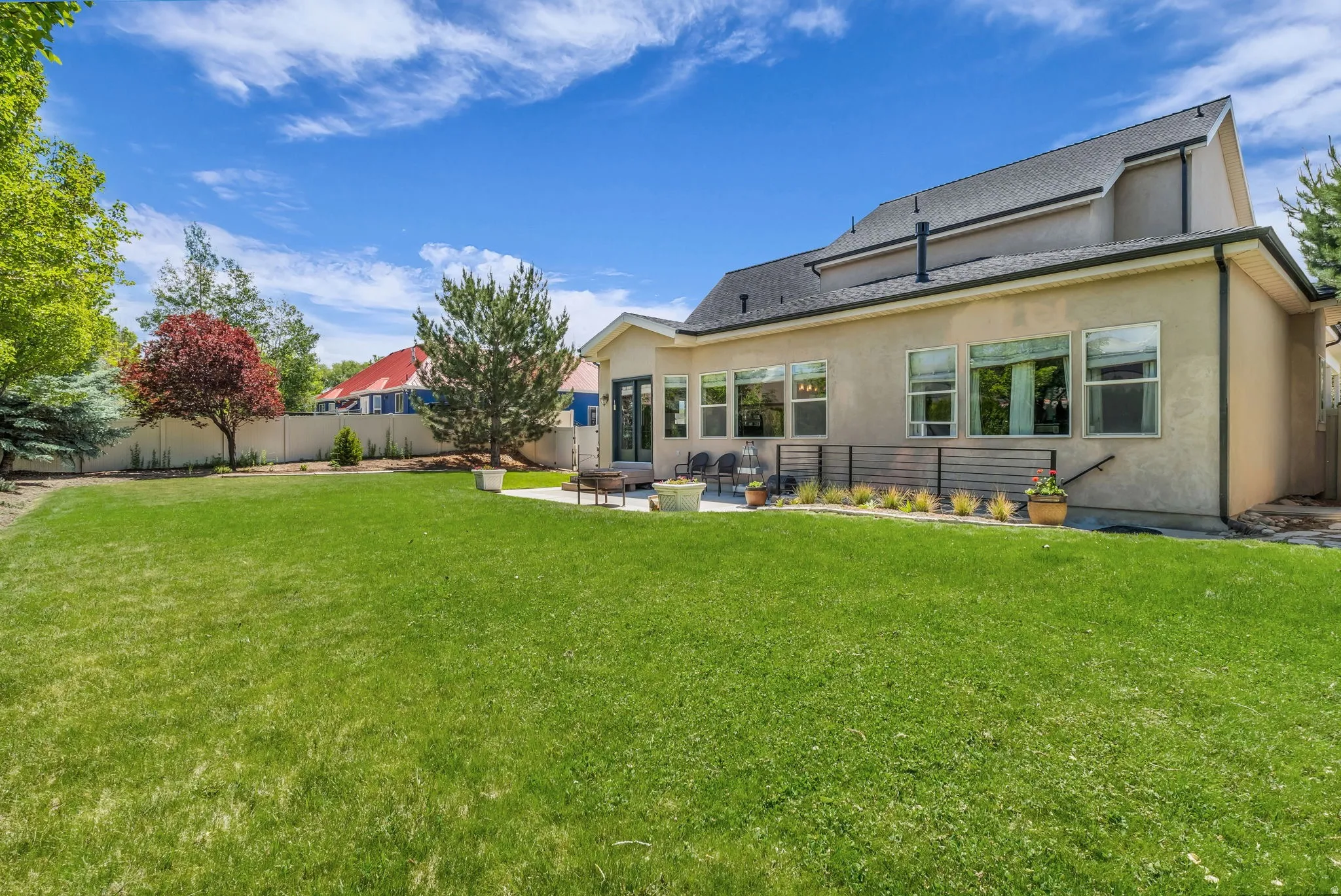 Fully fenced and landscaped backyard with patio