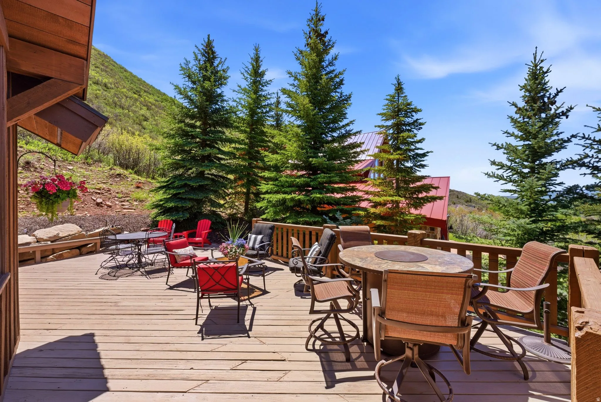 Expansive wood-finish deck with multiple seating areas