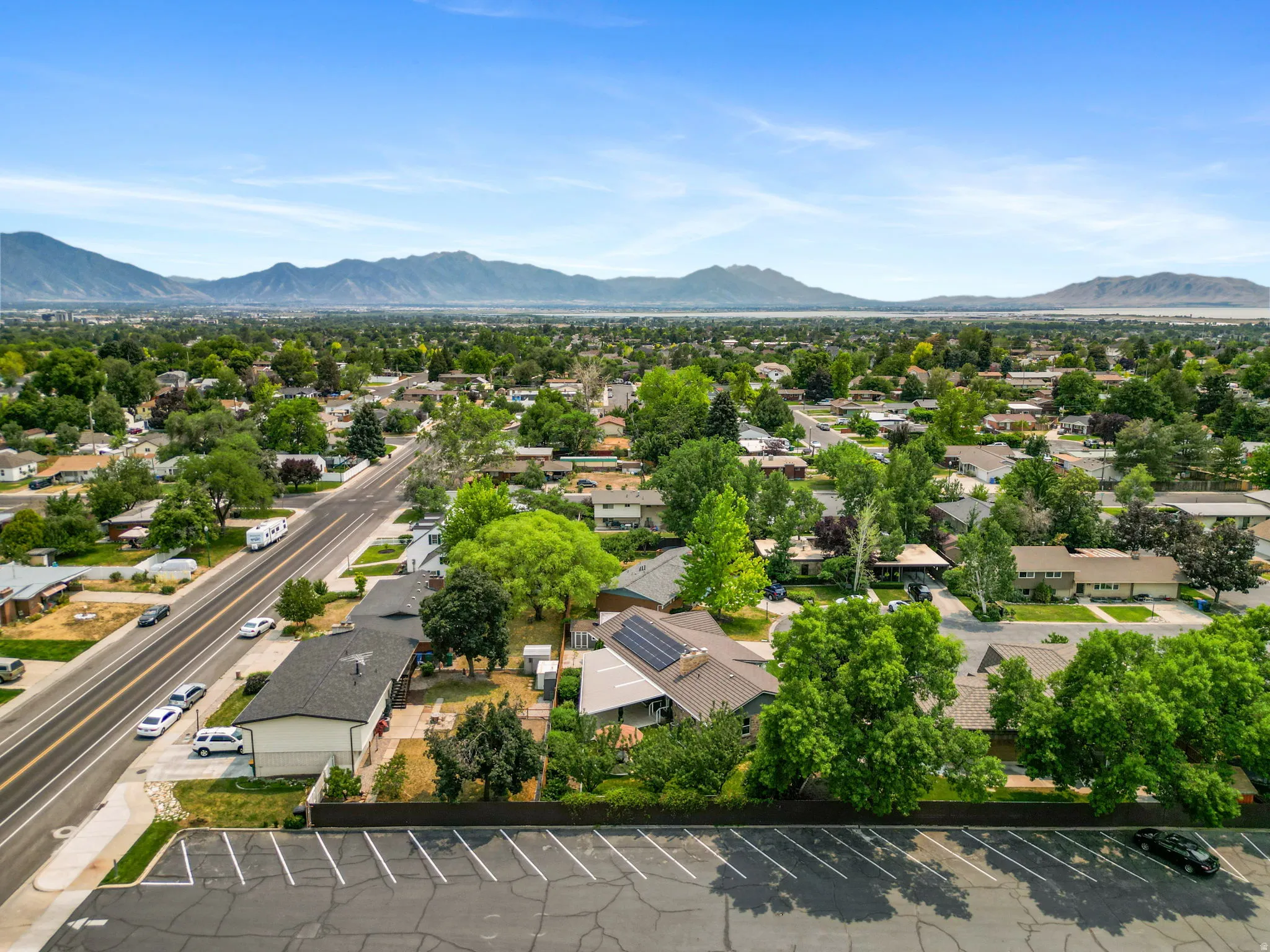 Expansive aerial perspective showcasing a residential neighborhood with mature trees