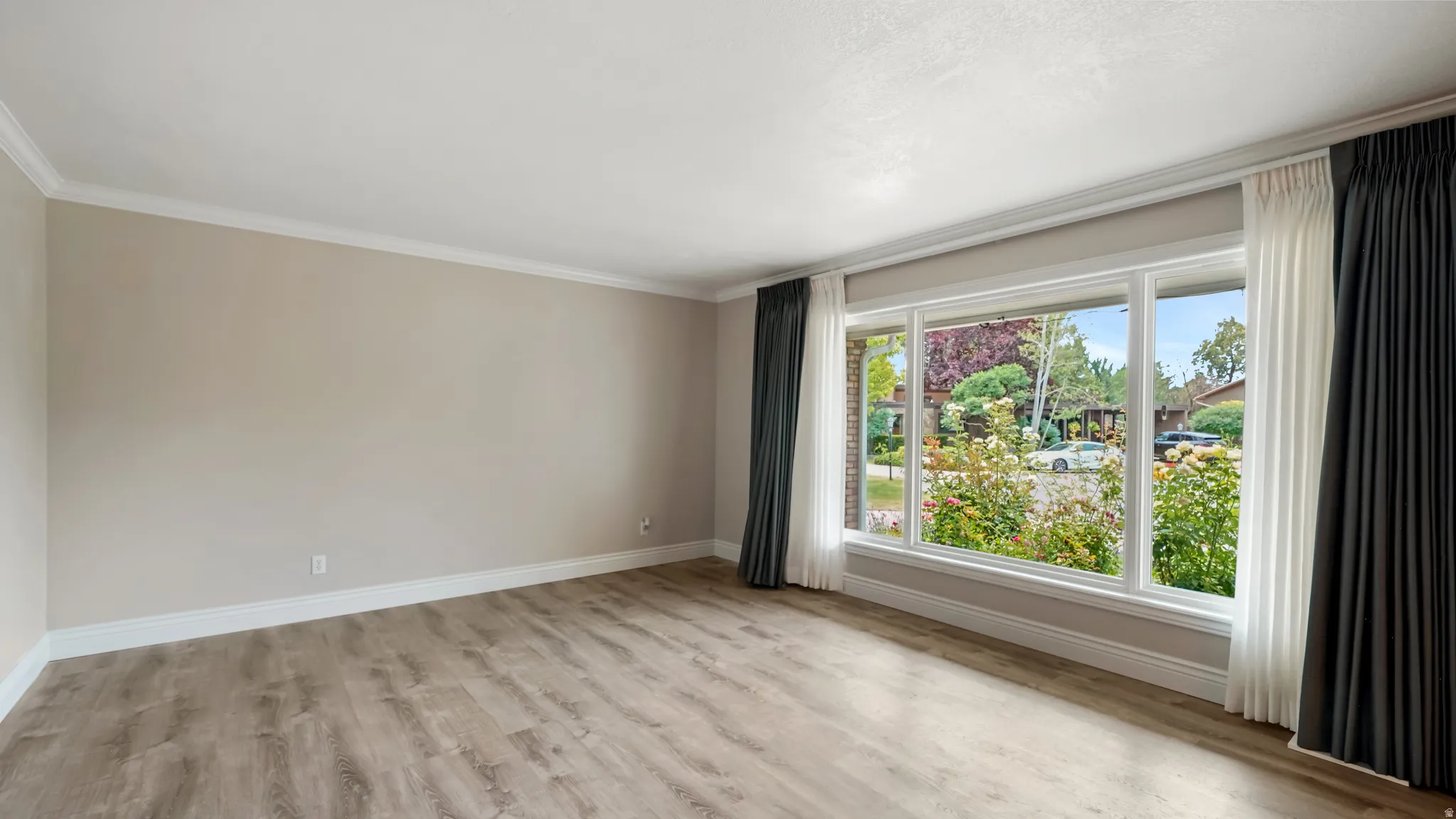 Expansive triple-pane window with white trim
