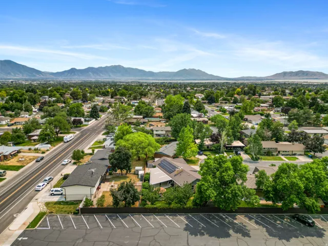 Expansive aerial perspective showcasing a residential neighborhood with mature trees
