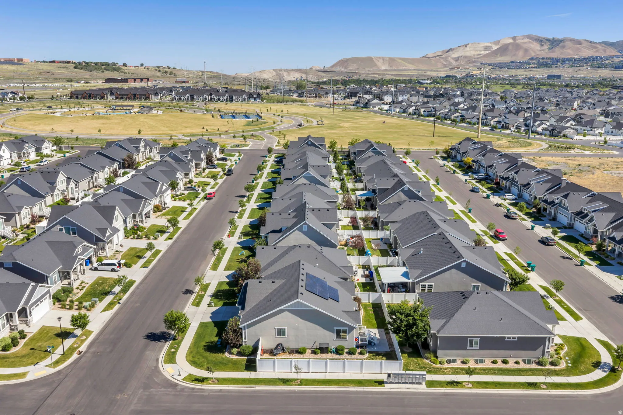 Aerial perspective showcasing a residential community with uniform housing designs