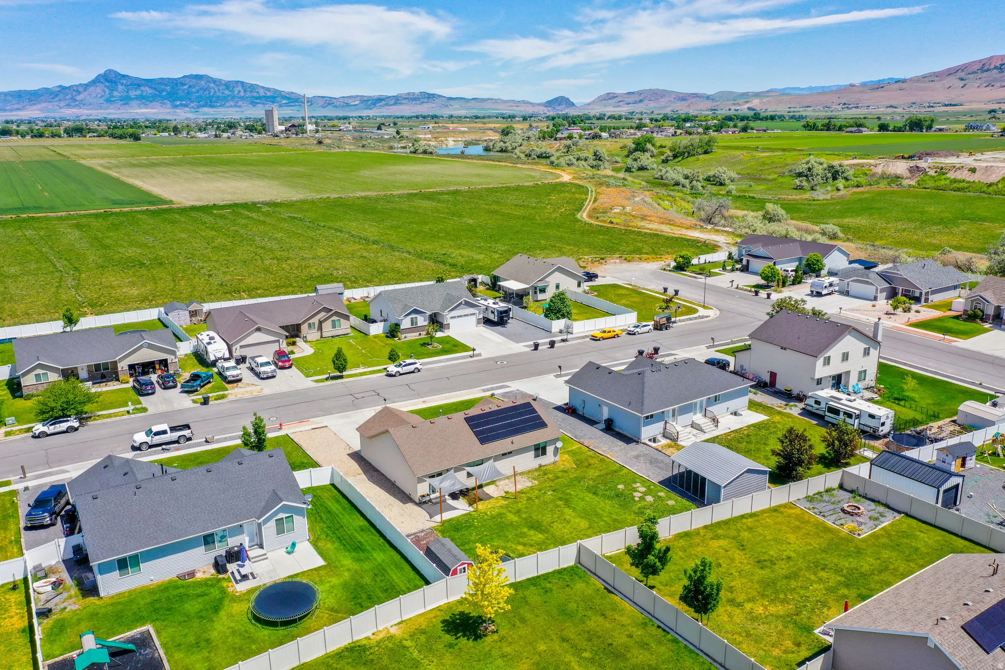 Residential subdivision featuring single-story and two-story homes with fenced backyards