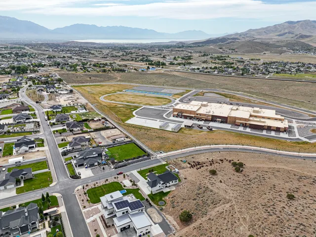 Suburban neighborhood with modern residential architecture and expansive undeveloped land
