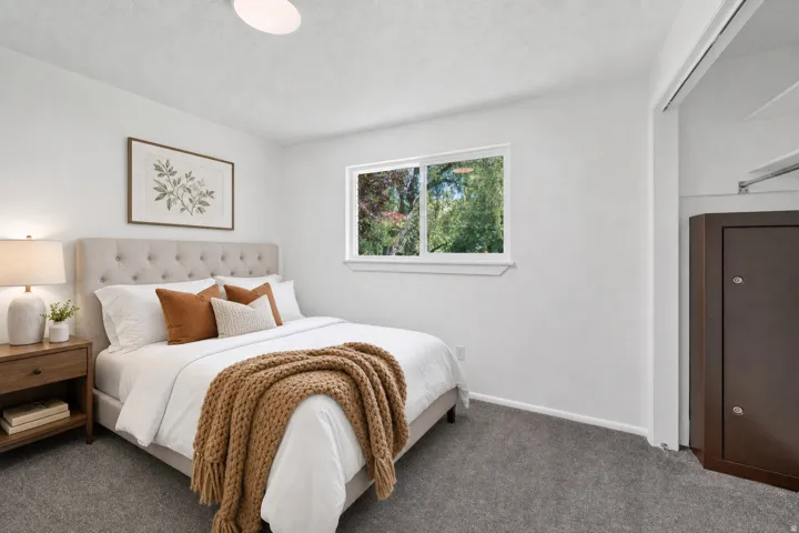 Virtual staging included to showcase room potential. Bedroom featuring gray carpeting and white walls
