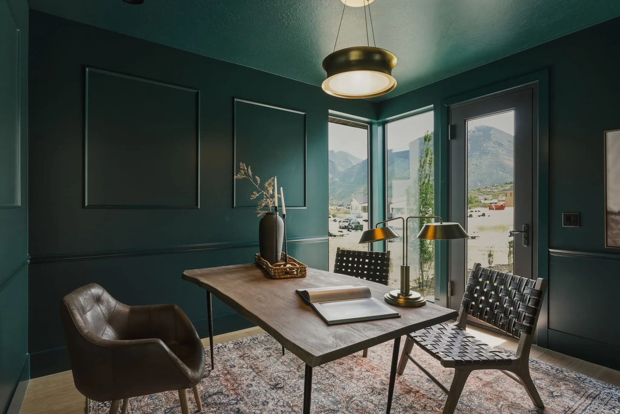 Interior room with dark green walls featuring decorative wall molding and a coordinating ceiling