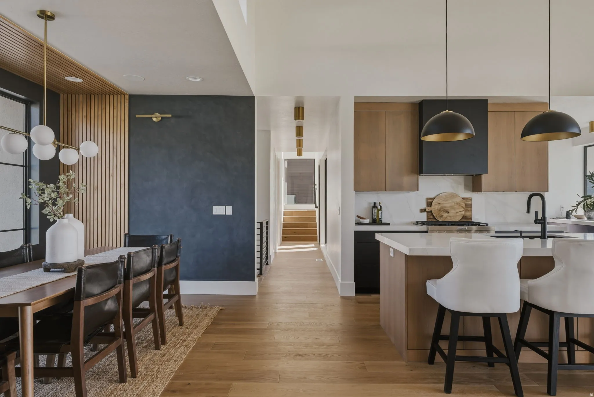 Open-concept living space with wood-finish flooring