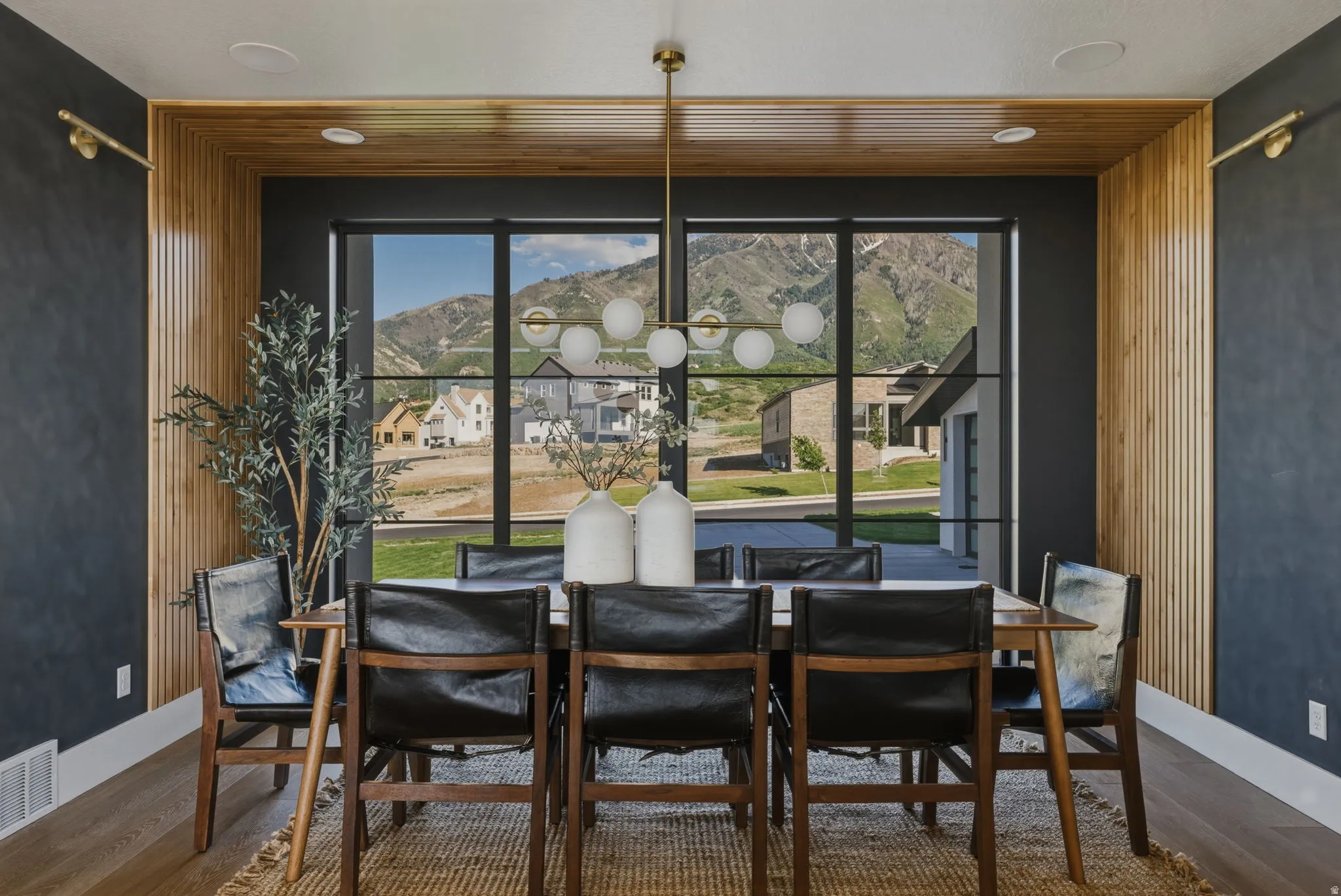 Dining area with a large window featuring mountain scenery