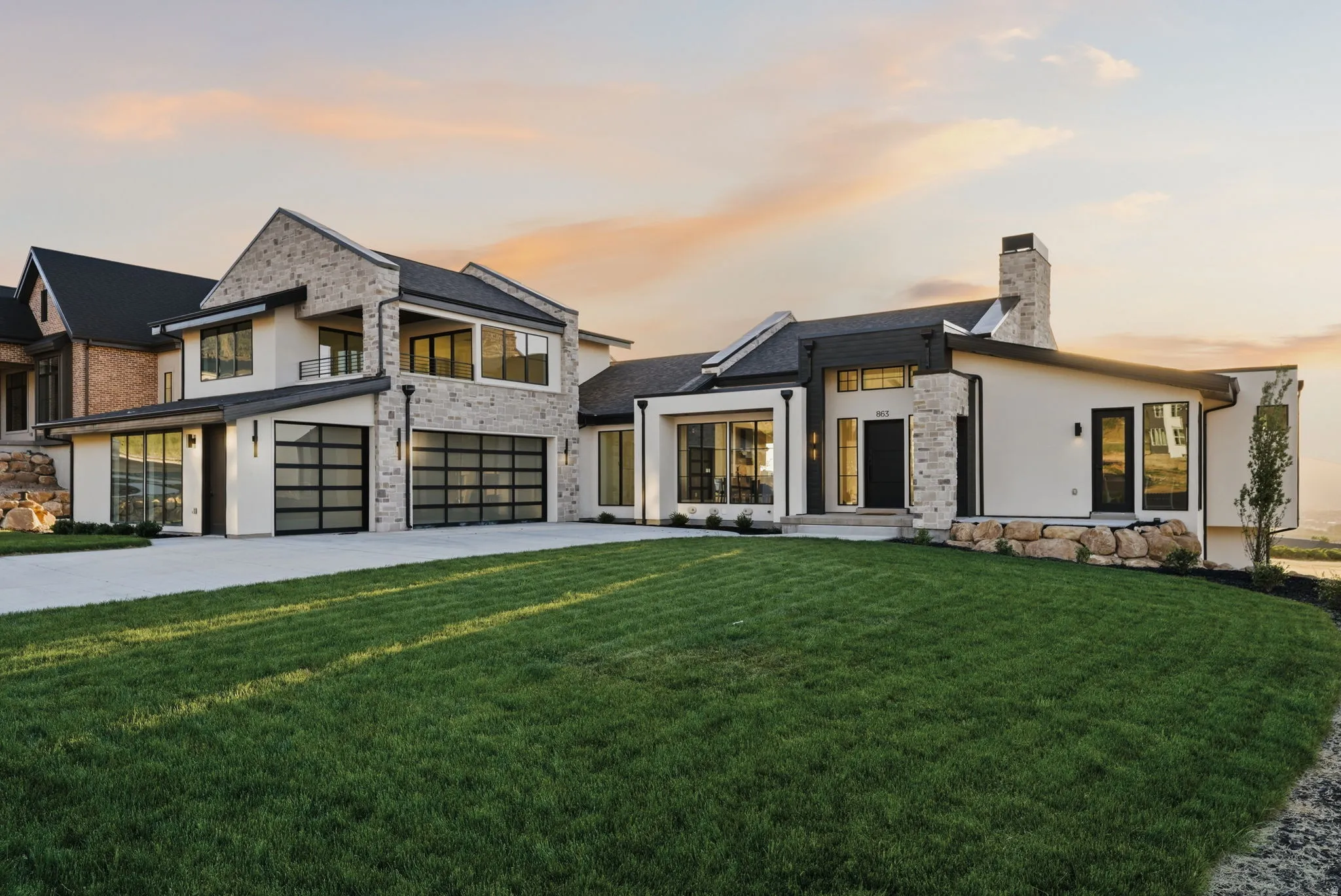 Contemporary exterior featuring mixed material facades of stone and stucco
