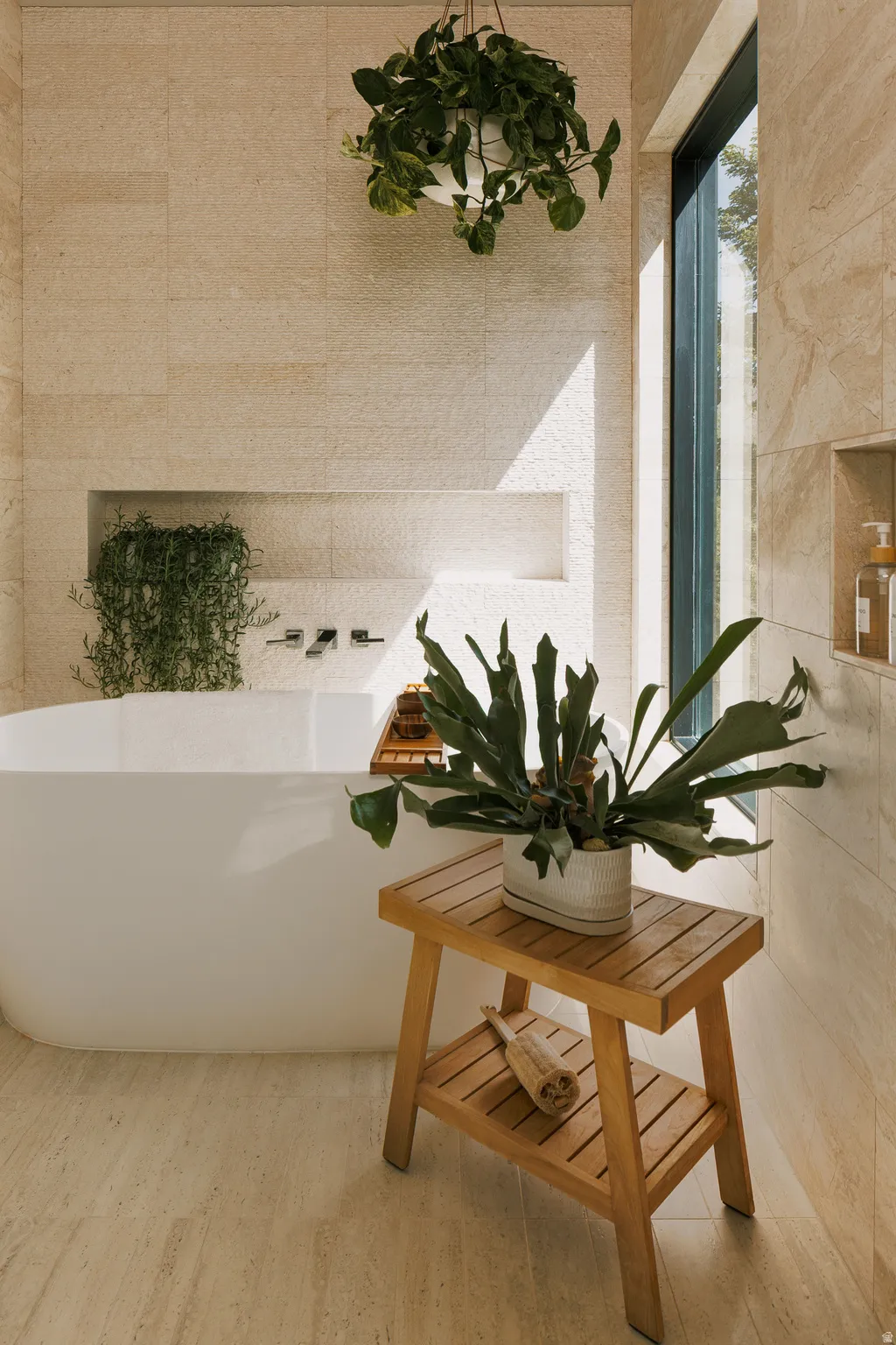 Freestanding soaking tub with floor-to-ceiling window