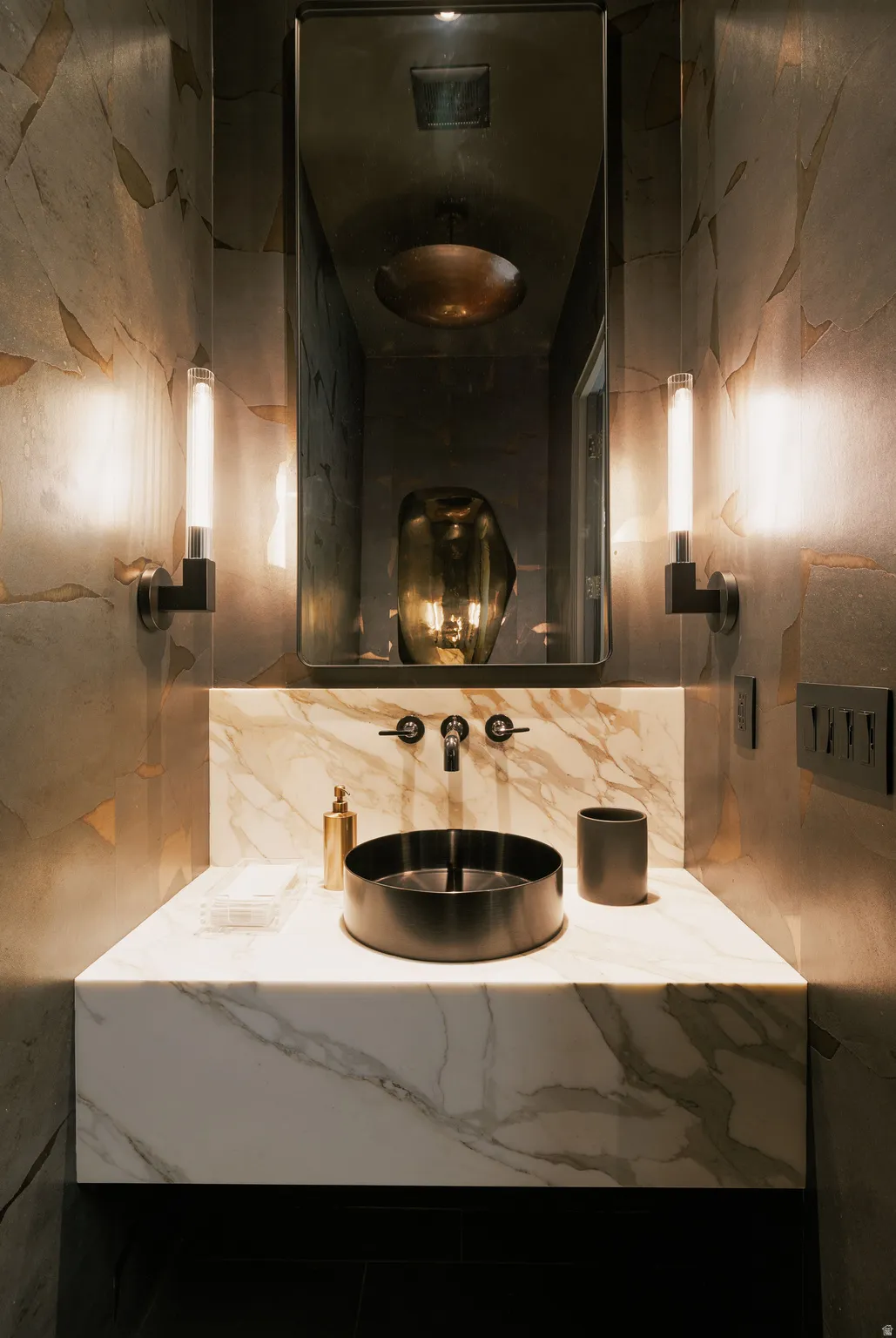 Floating vanity with a stone countertop and integrated sink, featuring a wall-mounted faucet