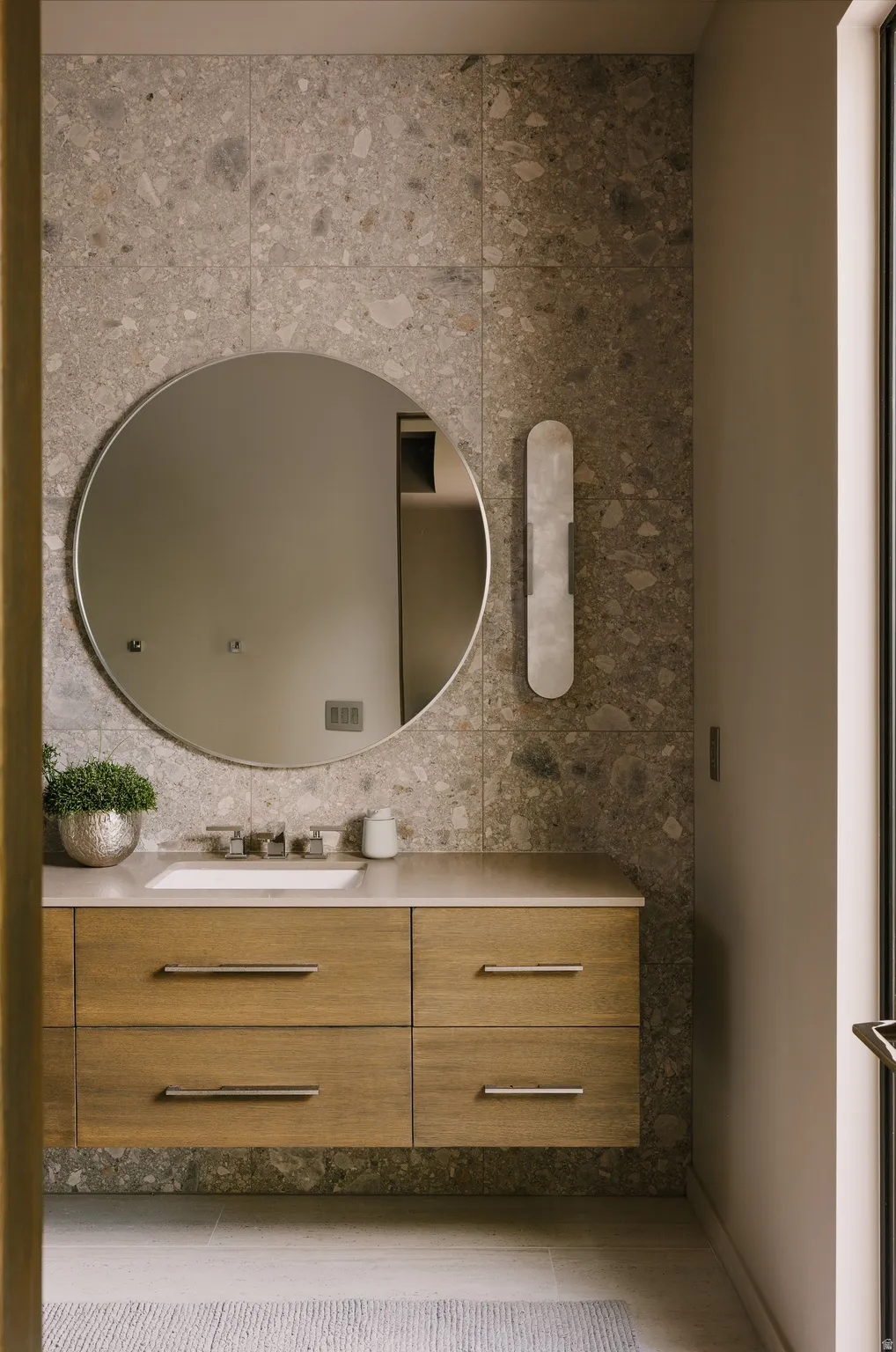 Floating wood-finish vanity with an integrated rectangular sink
