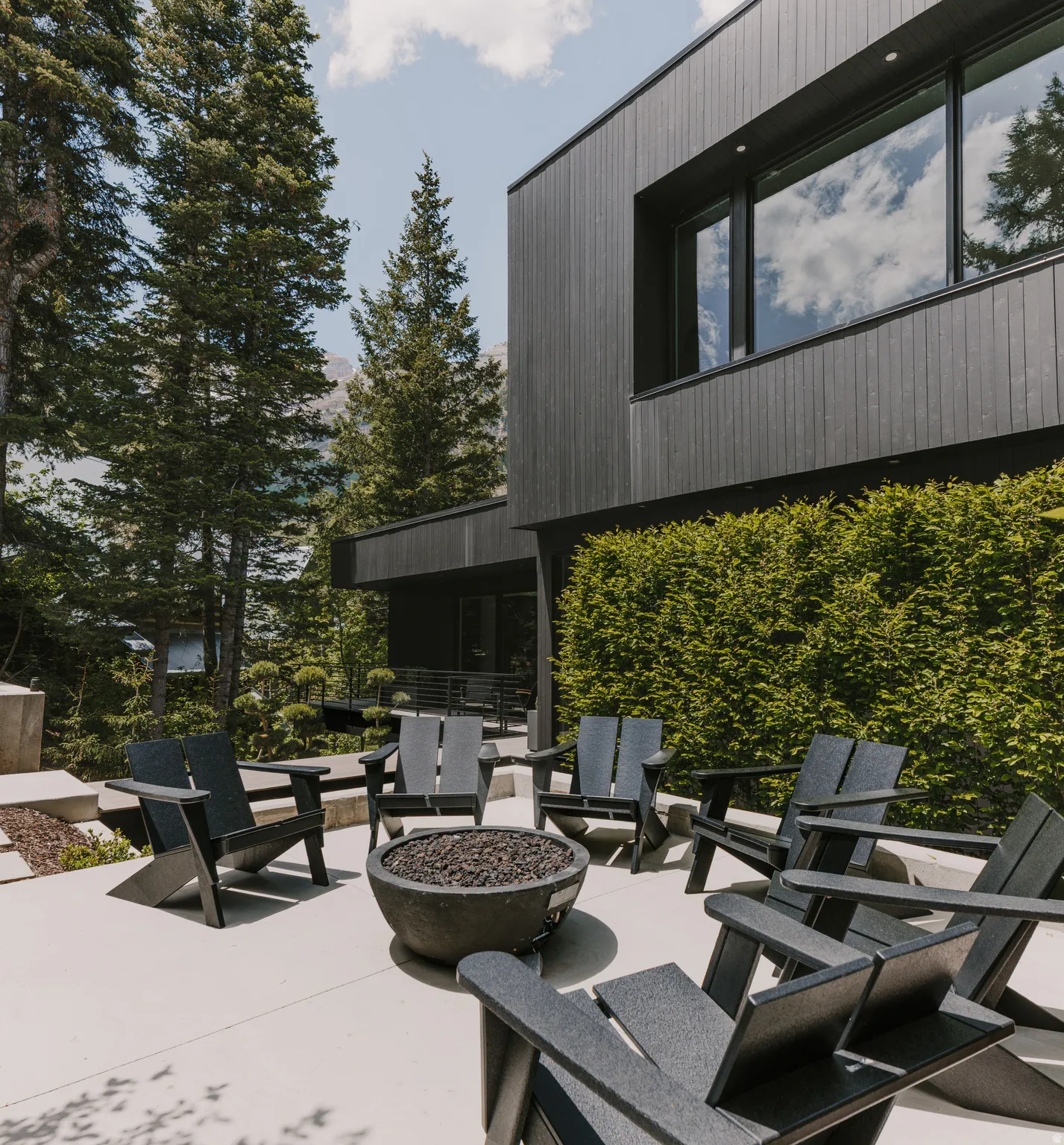 Modern exterior featuring dark vertical siding and large windows