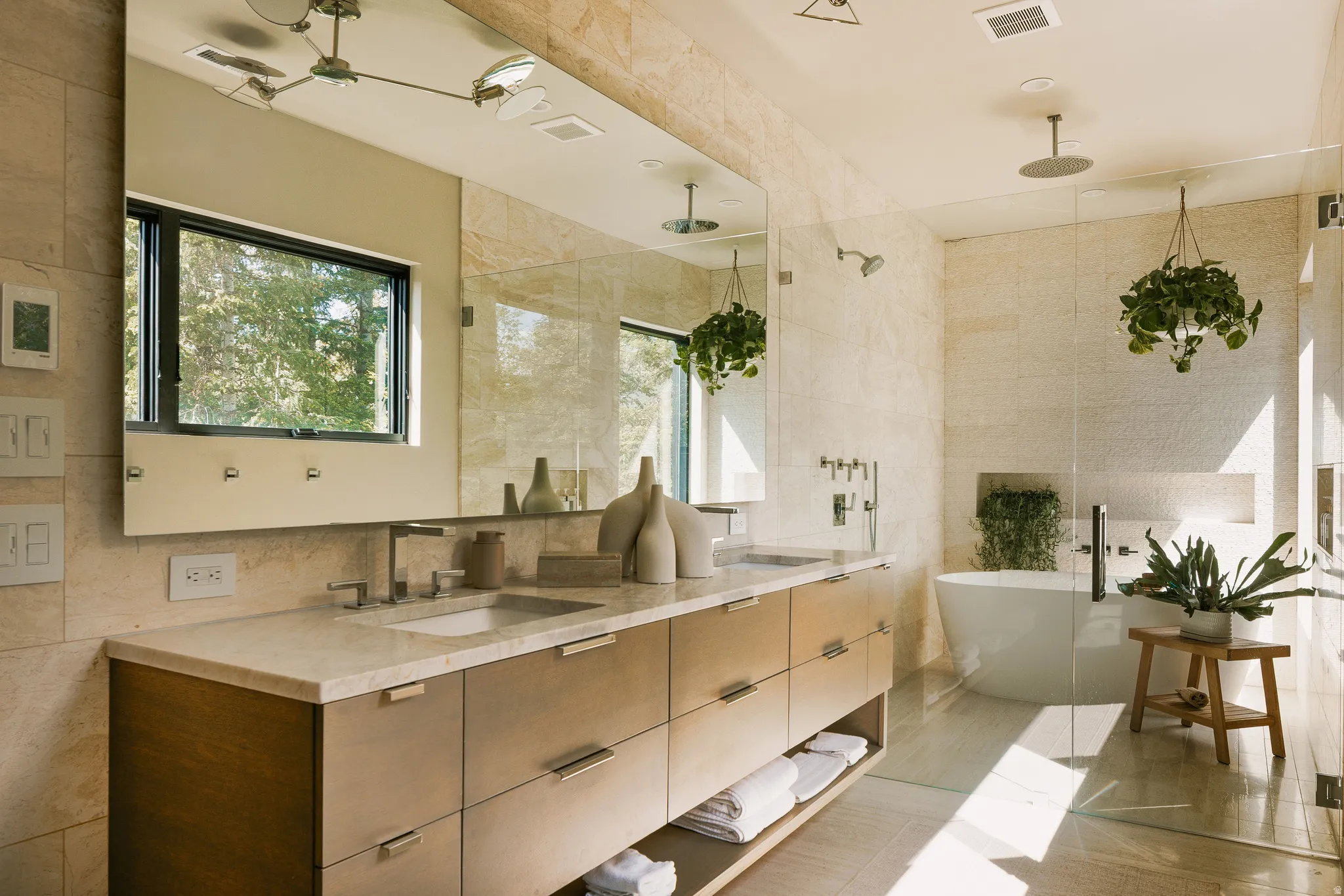 Dual vanity featuring an integrated rectangular sink, stone countertop, and wood-finish cabinetry
