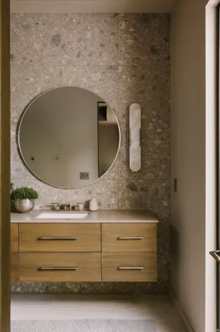 Floating wood-finish vanity with an integrated rectangular sink