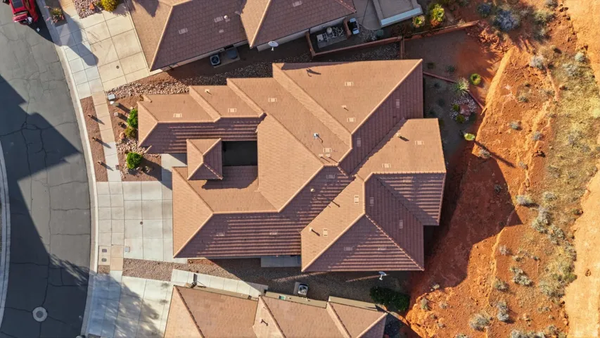 Expansive tiled roofline with multiple gables and a central courtyard