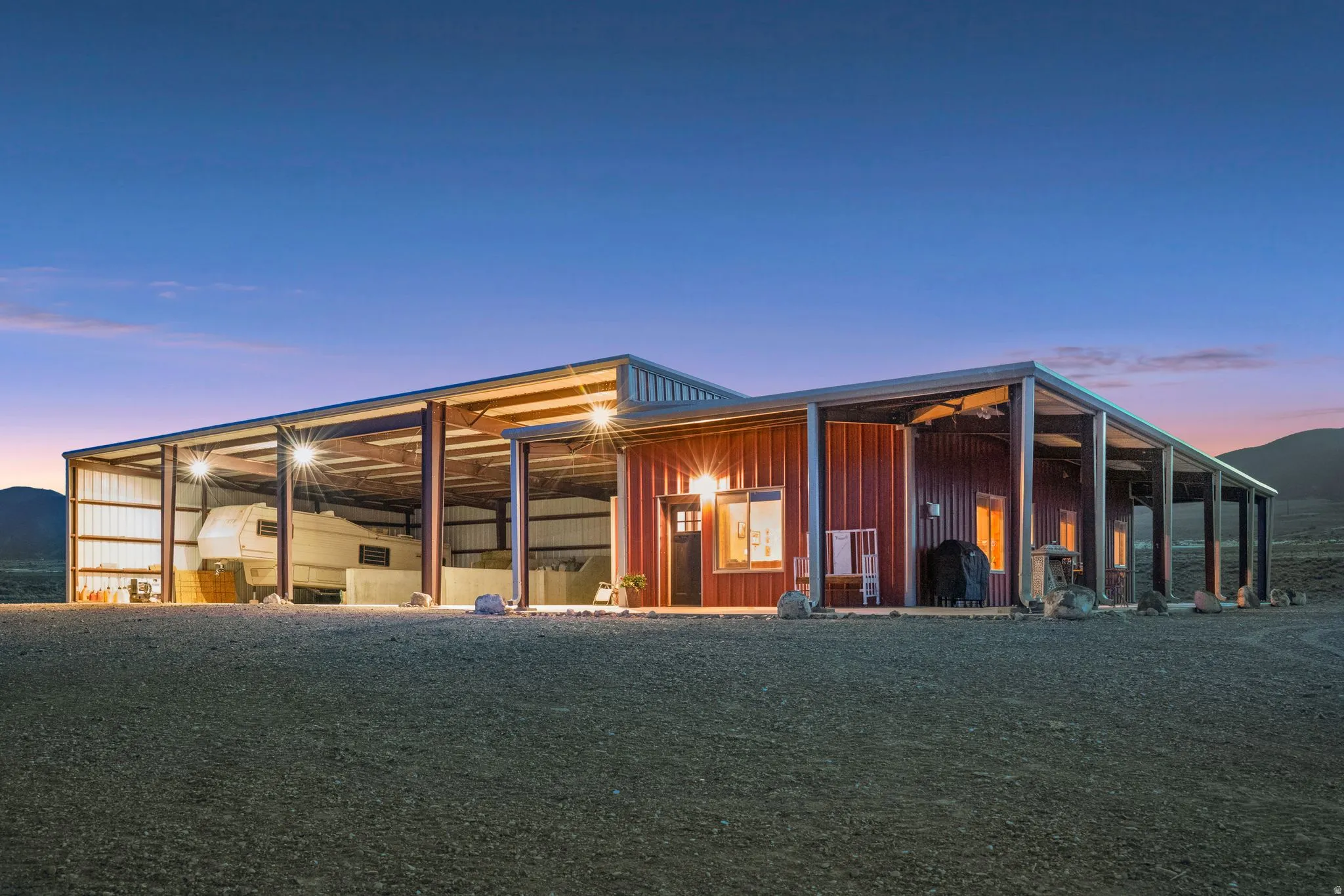 Detached ADU & Ranch Support Building 50' x 120' Approx. 6,000 sq ft total building footprint. Includes two living quarters: a 2-bed/1-bath apartment and a studio, plus RV storage, RV hookups & dumps, Septic tank, and equipment/storage space.