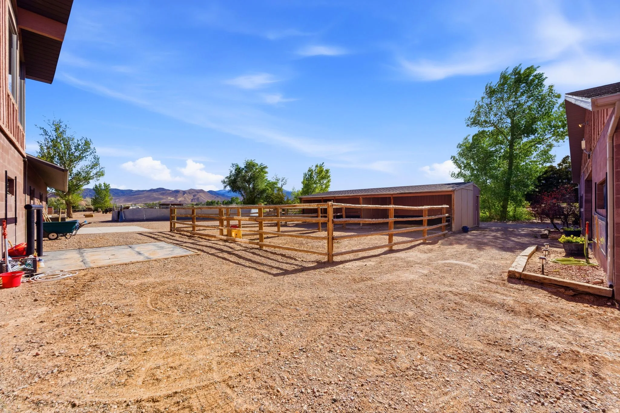Adjacent to the main home is a large shavings bin,an outdoor wash rack, and a manure bin.