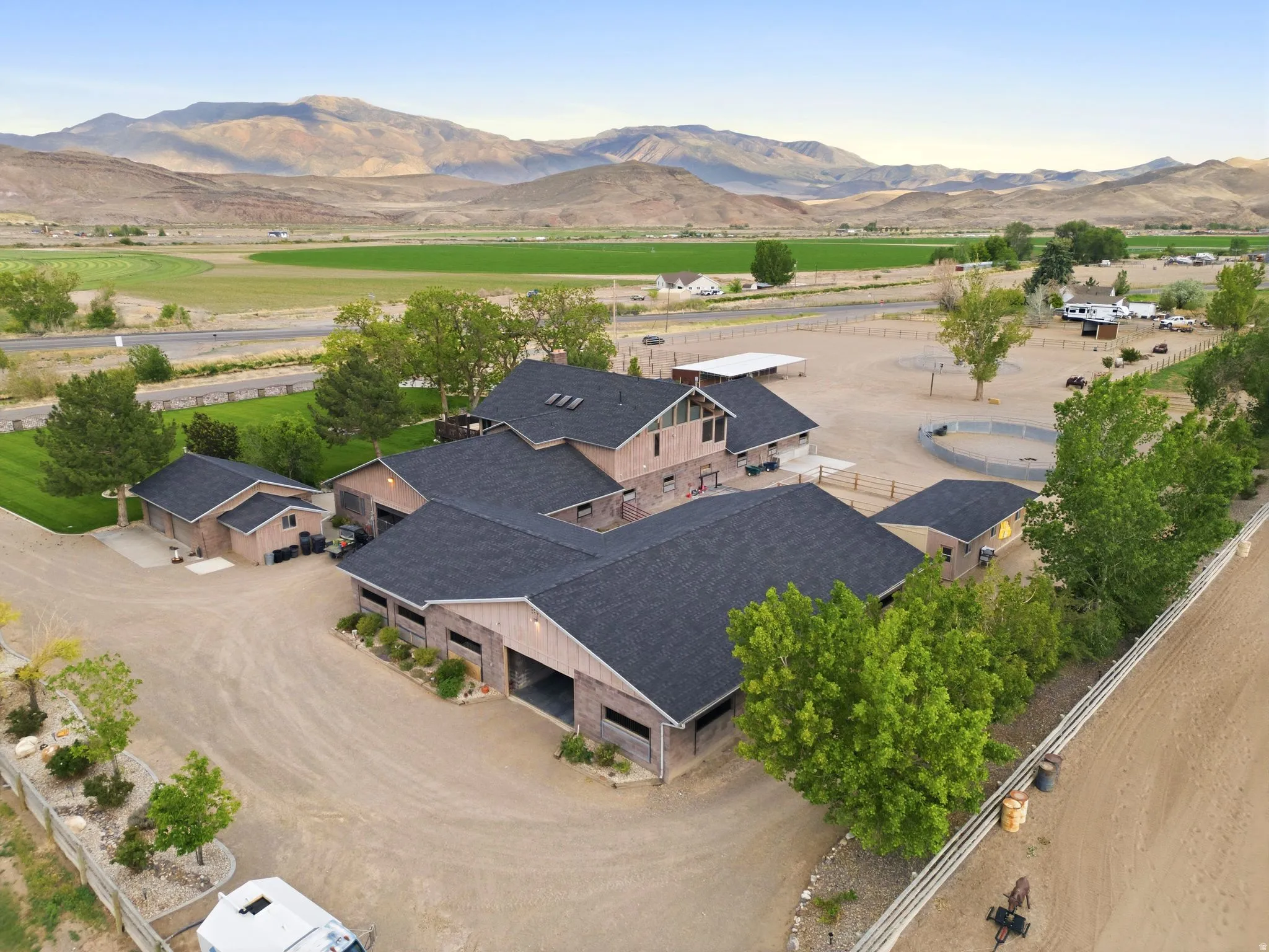 Main Residence, Main Breeding / Veterinary Barn, Stallion / Back Barn & Detached 2 Car Garage. Double sided door for drive through access.