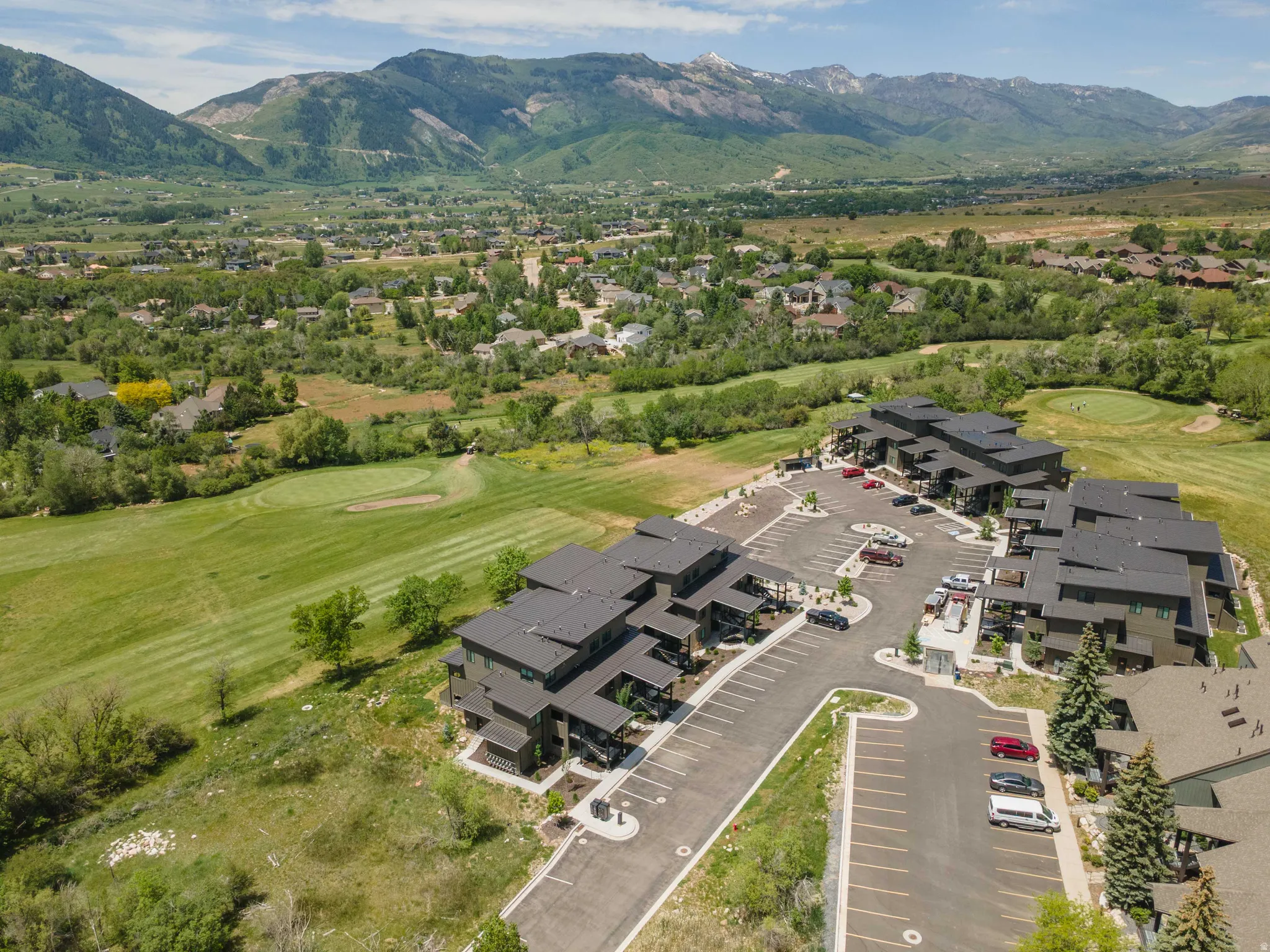 Modern multi-story buildings with dark facades and flat roofs