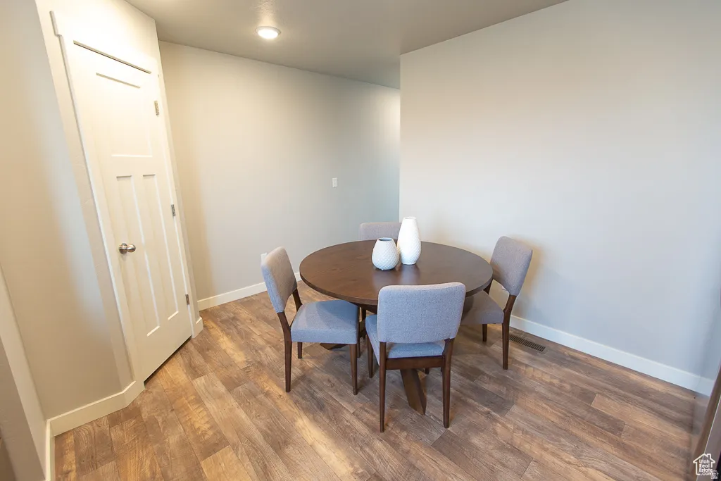 Dining area featuring wood-finish flooring and neutral wall tones