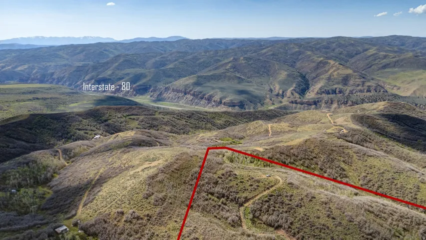 Expansive mountain terrain with visible property boundaries