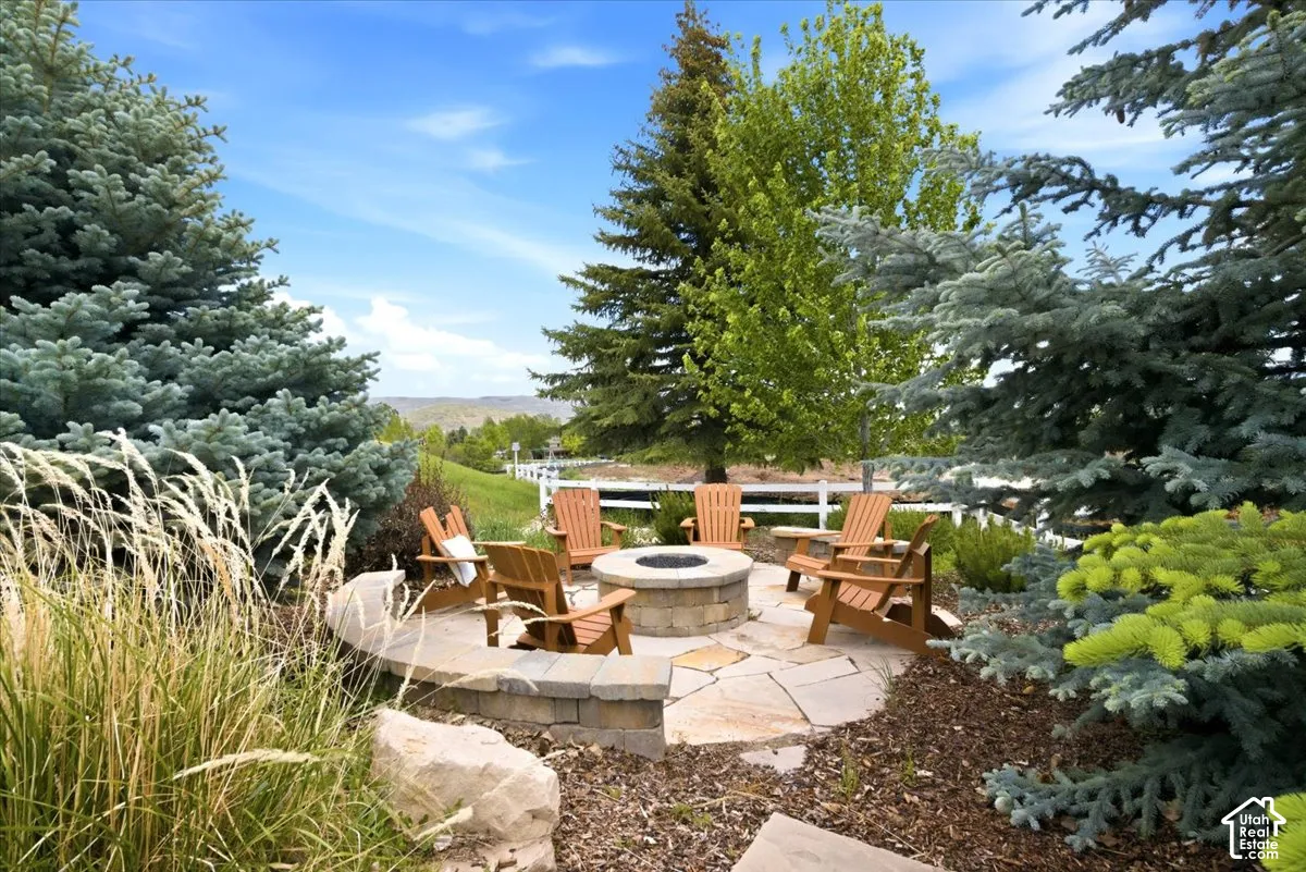 Stone fire pit area with a flagstone patio