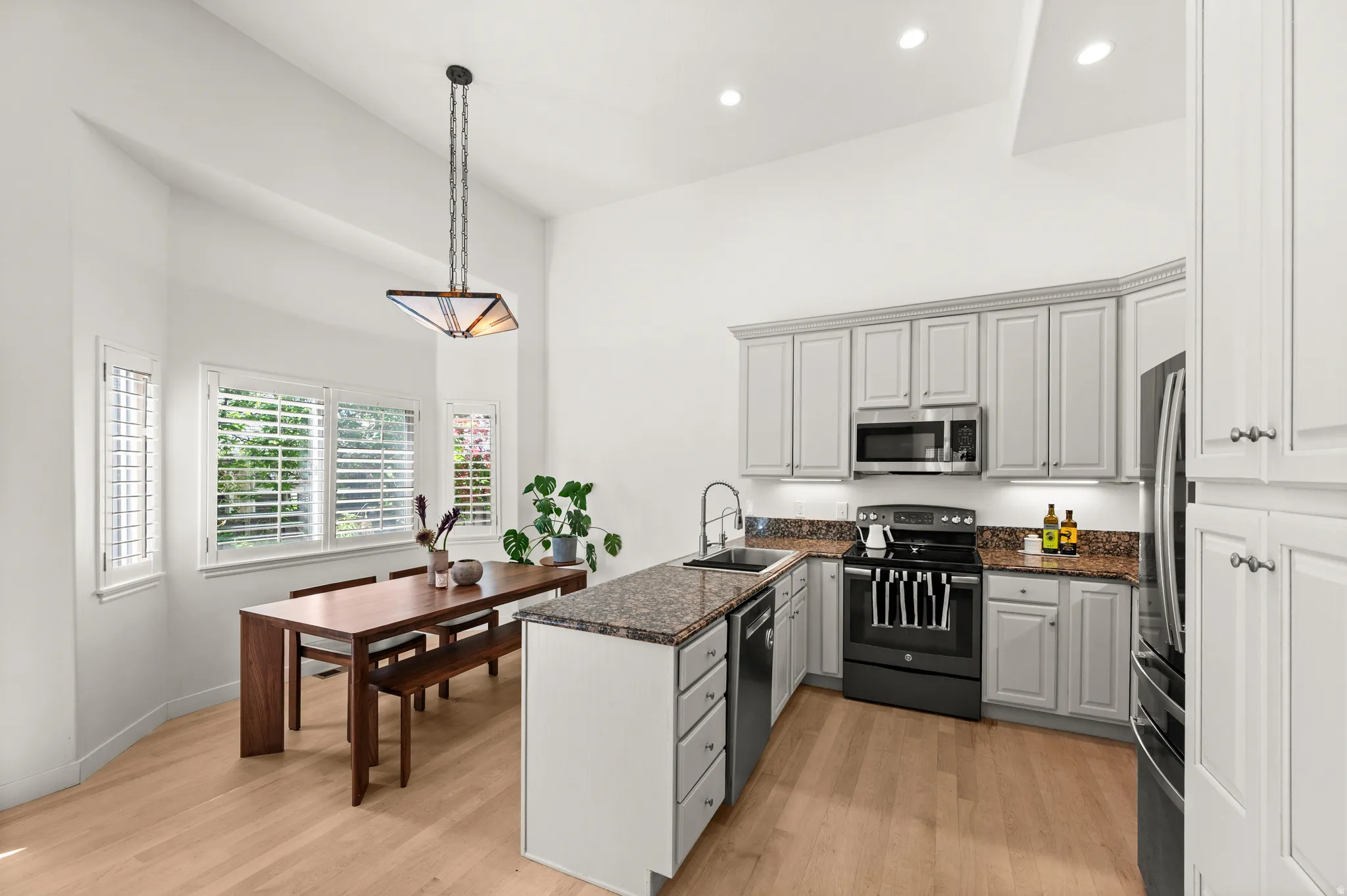 Kitchen with stainless appliances, granite counters and under cabinet lighting