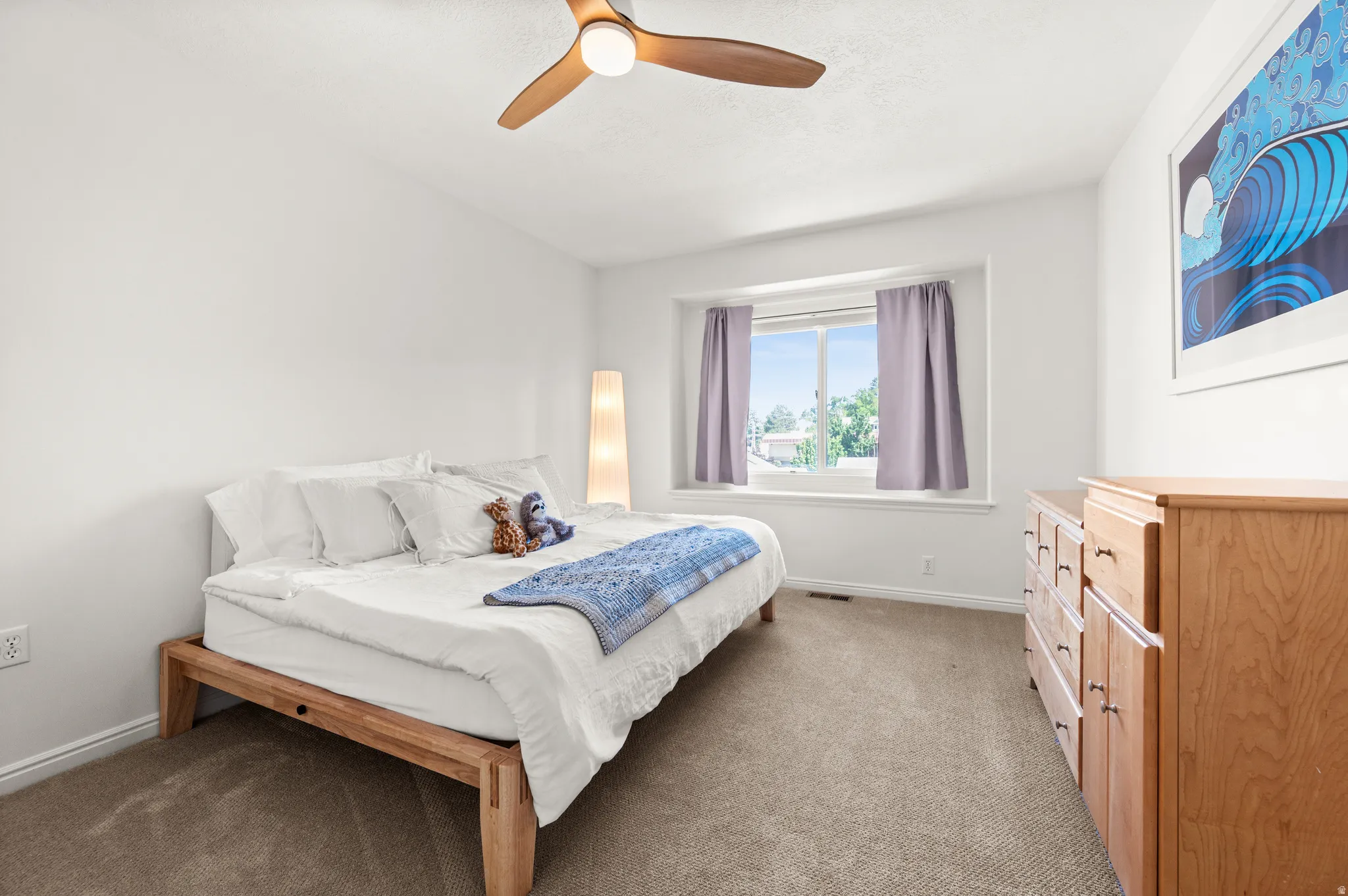 Bedroom featuring ceiling fan and north facing window