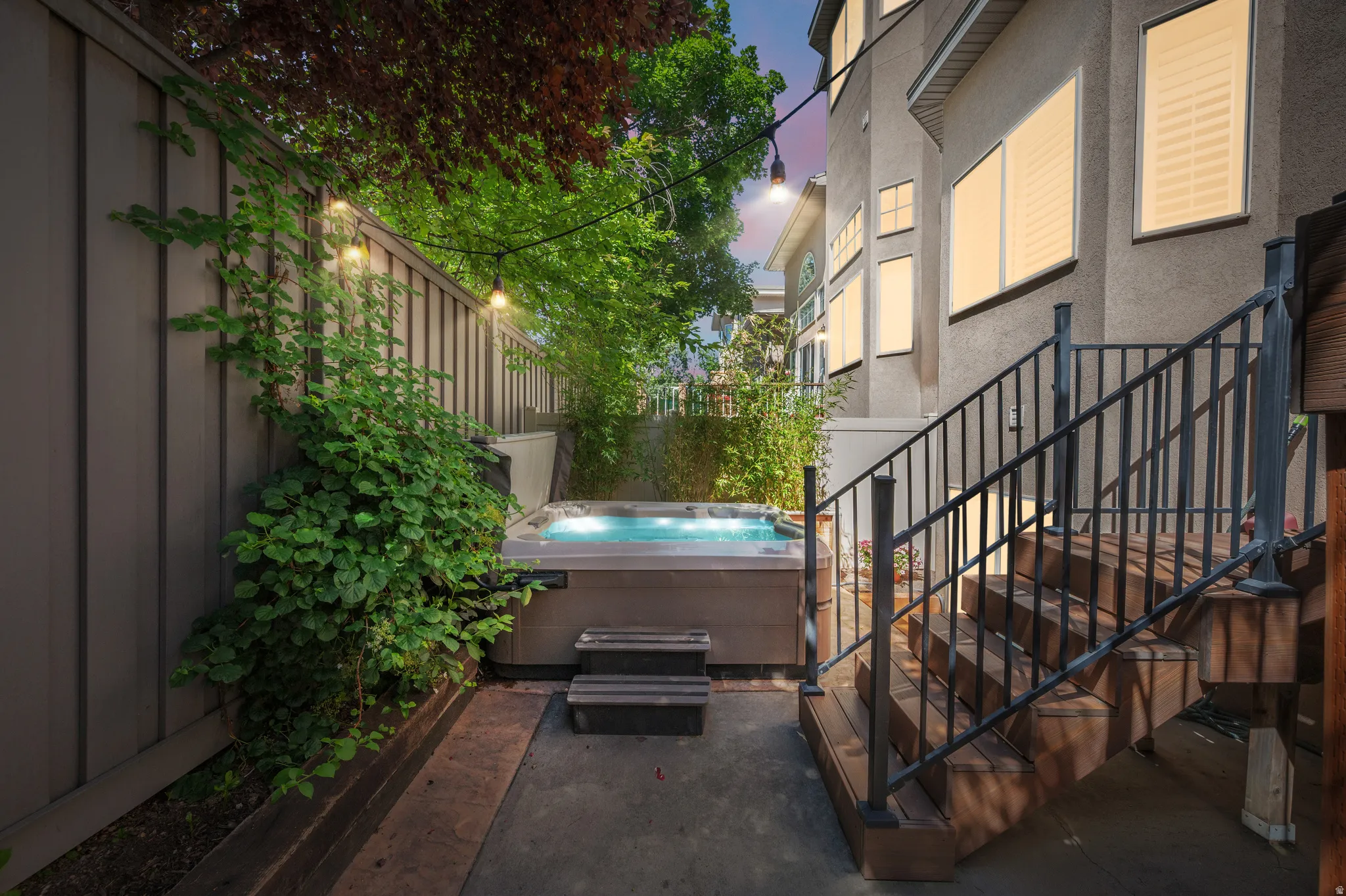 Private outdoor area featuring hot tub