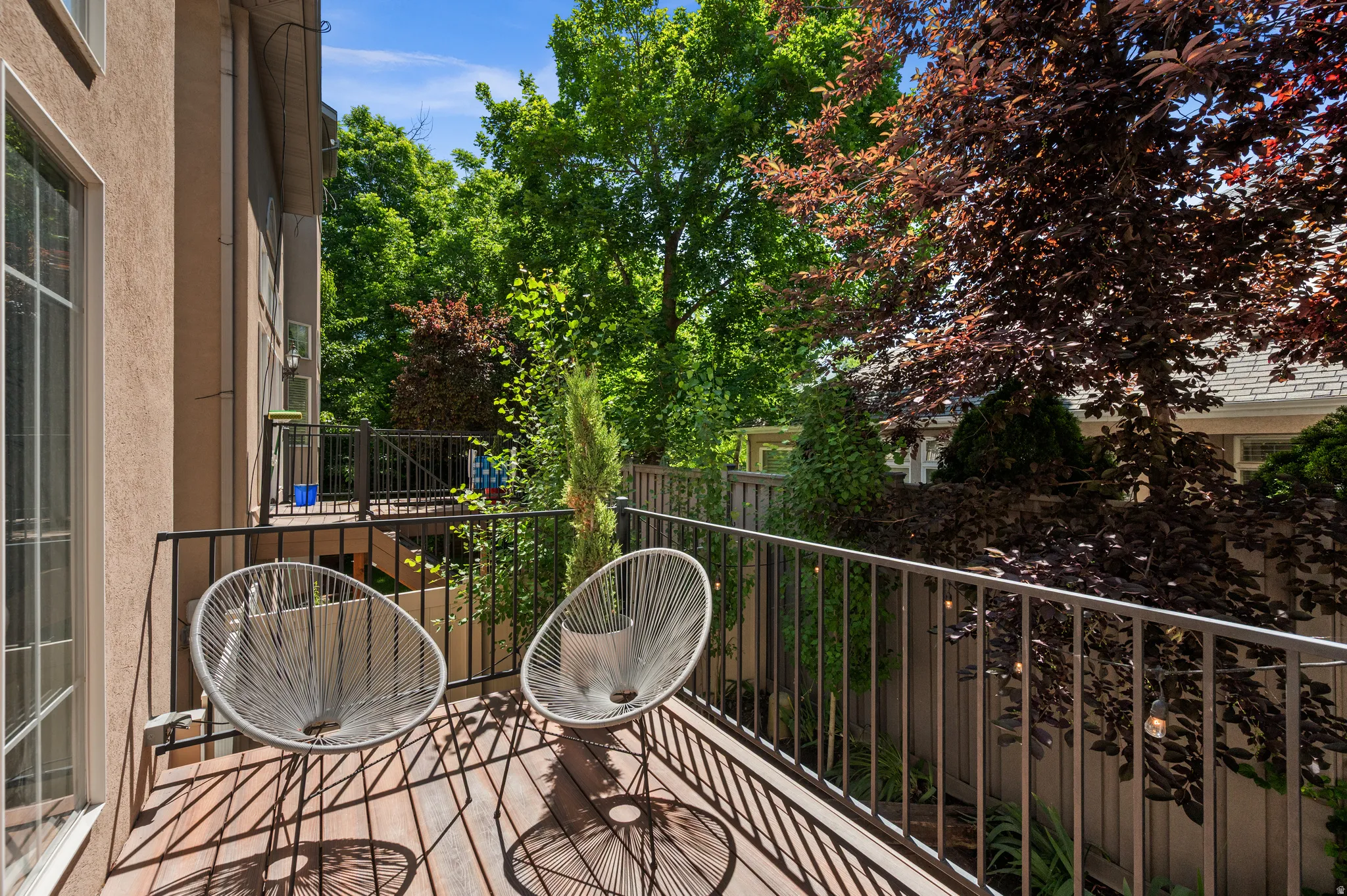 Private backyard deck with stairs to backyard patio and hot but