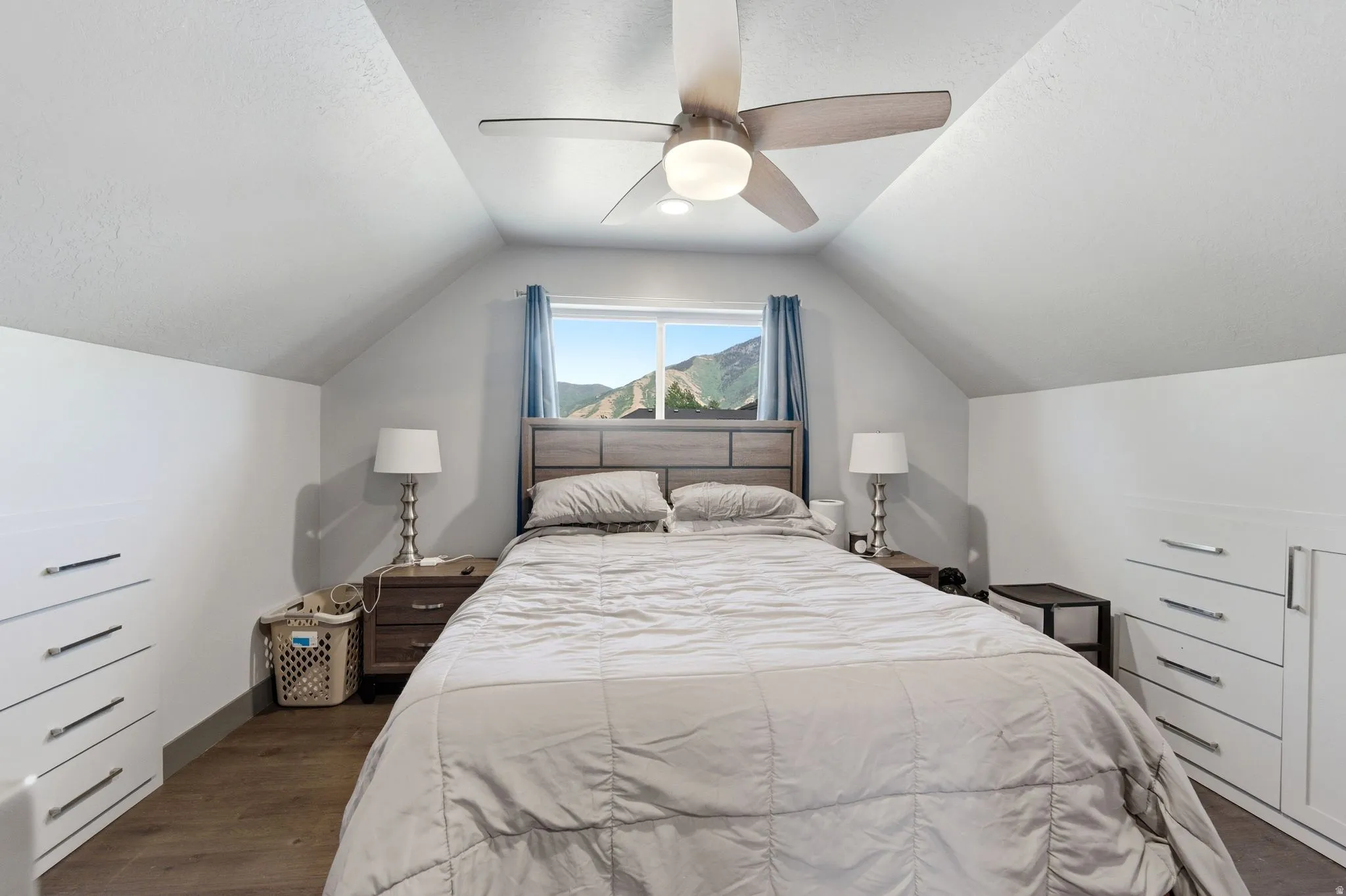 Vaulted ceiling with a contemporary ceiling fan and light fixture