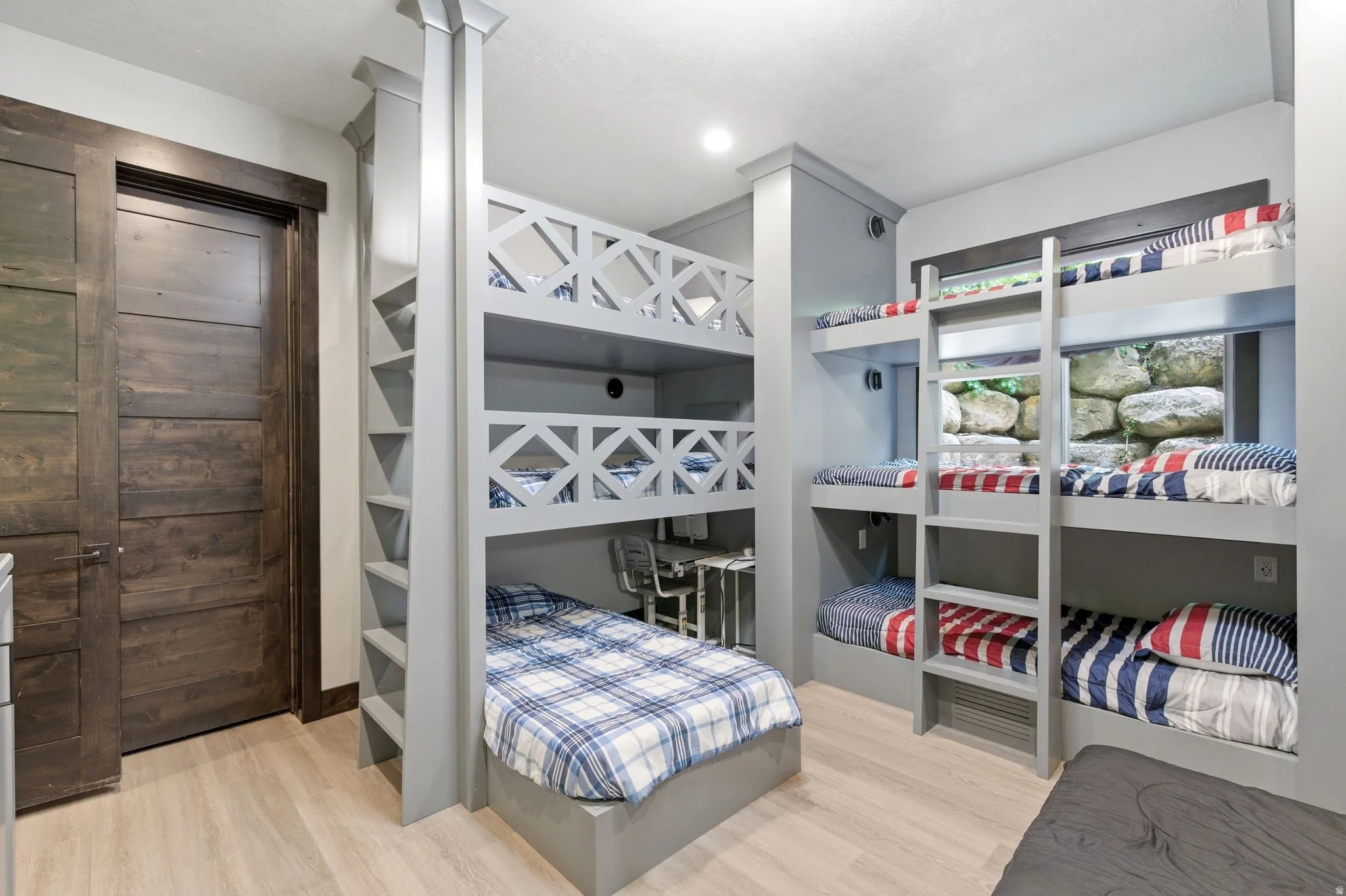 Built-in bunk beds featuring integrated ladders and individual lighting