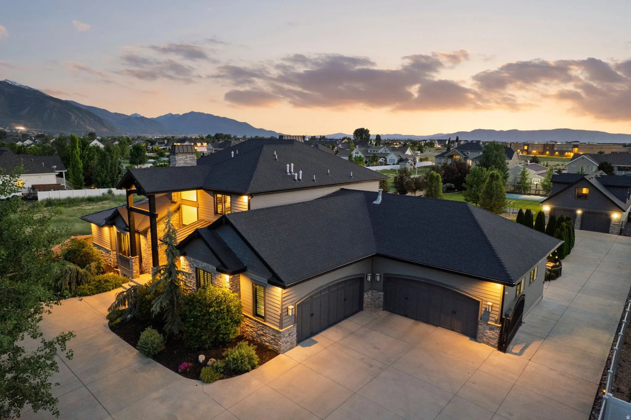 Contemporary exterior with prominent stone and horizontal siding accents