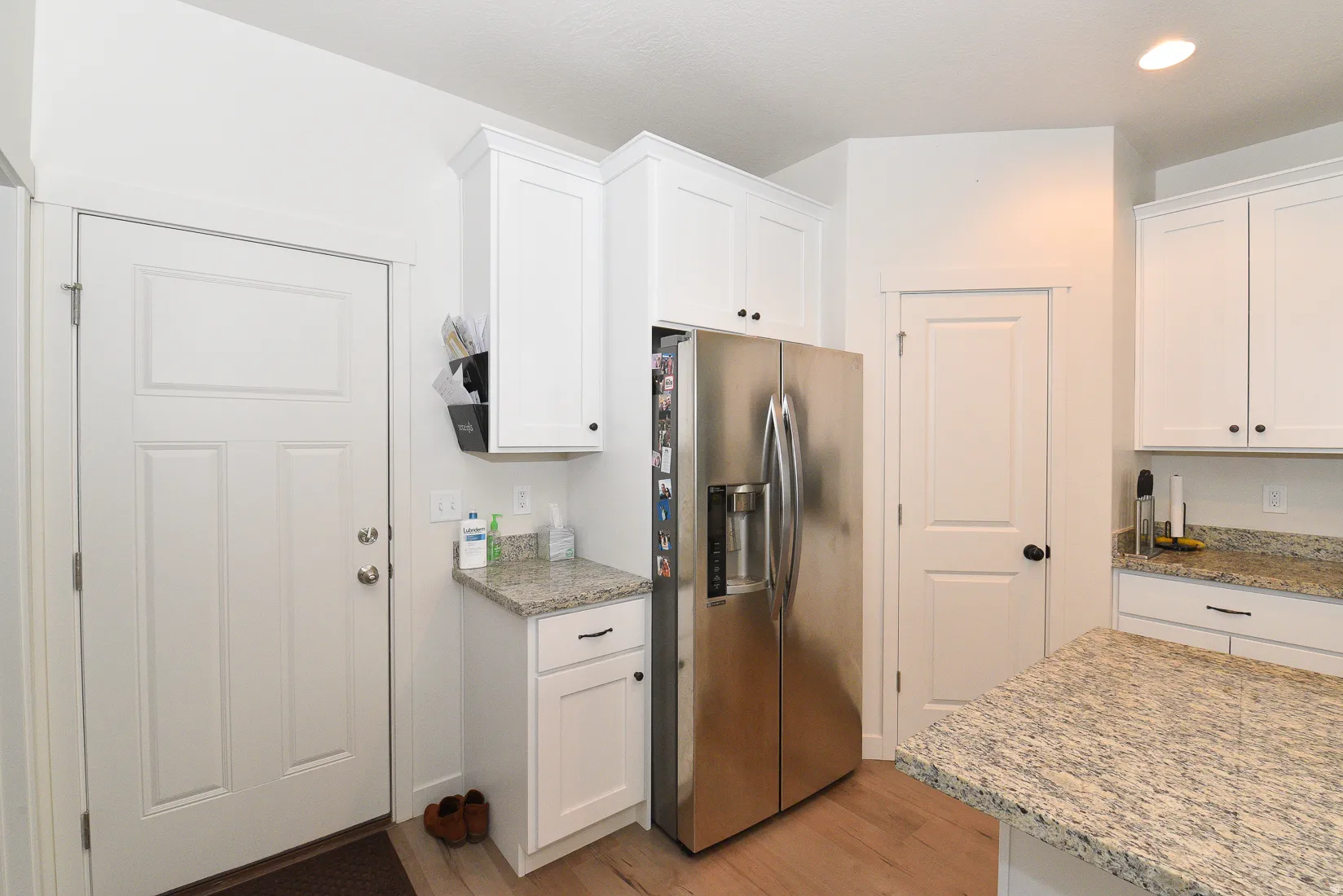 White shaker-style cabinetry with dark hardware