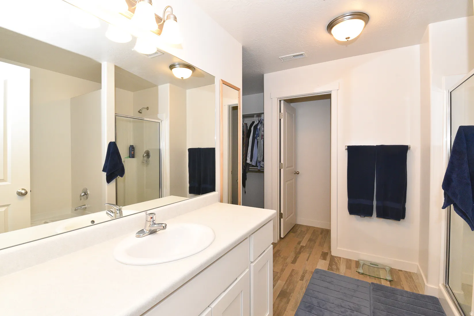 Bathroom vanity with an integrated sink and chrome faucet