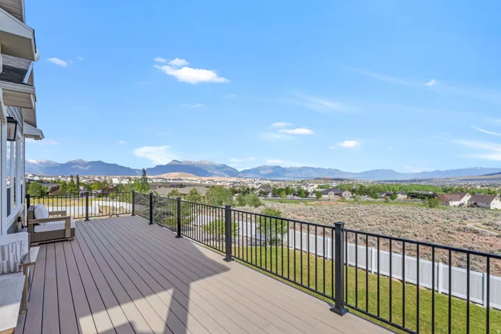 Expansive outdoor deck featuring composite decking and black metal railings