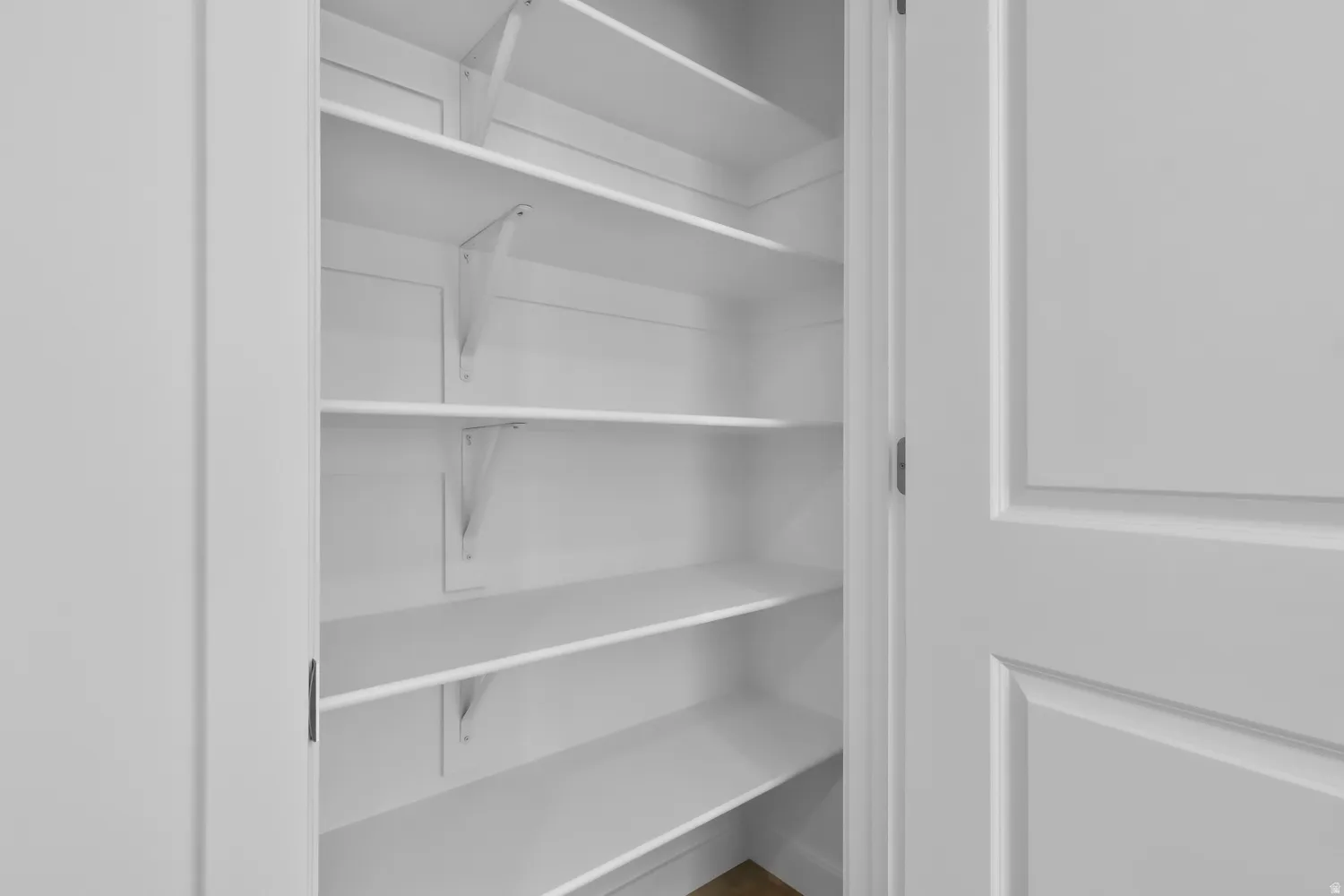Built-in shelving system with white finish